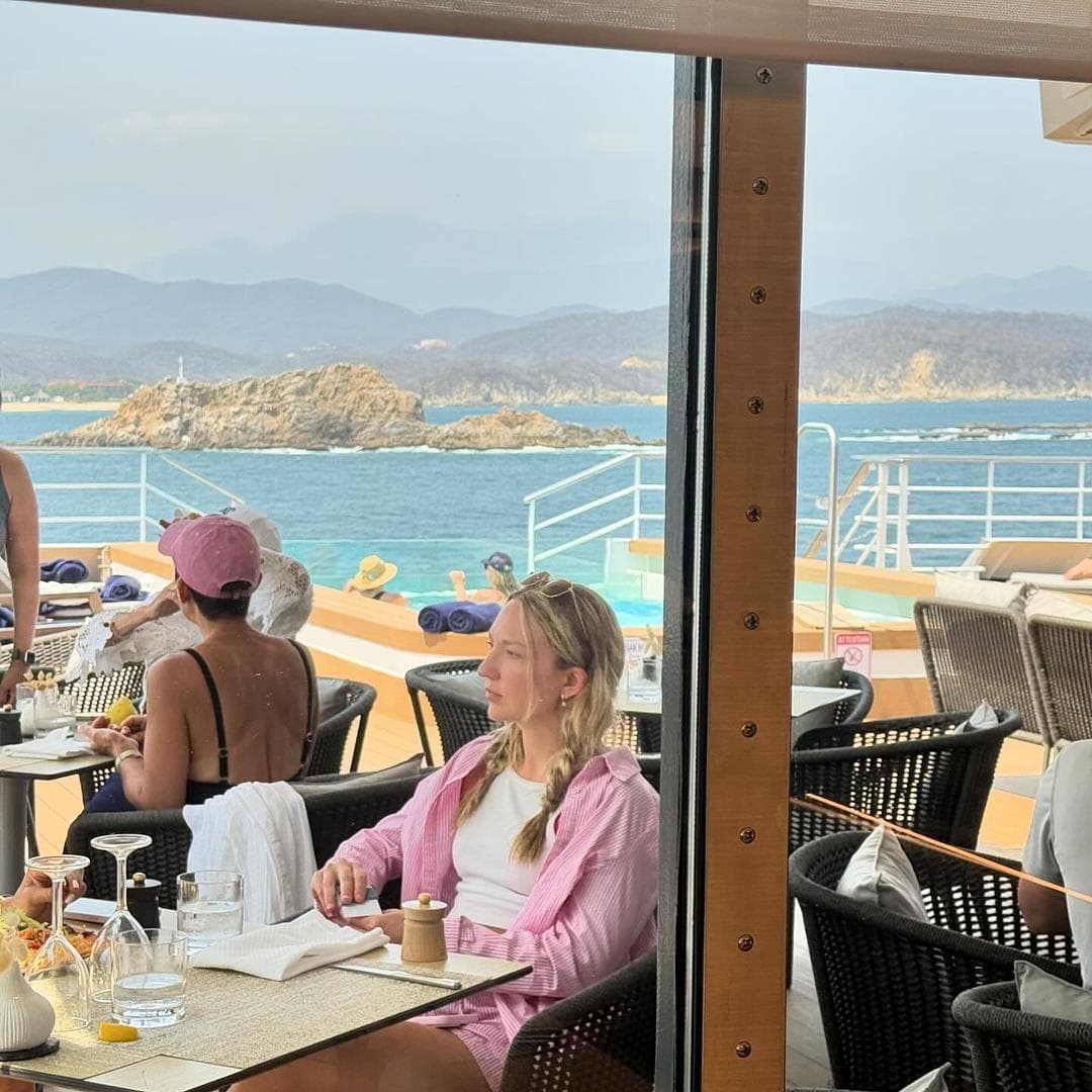 Outdoor dining on the ship with the ocean in view.