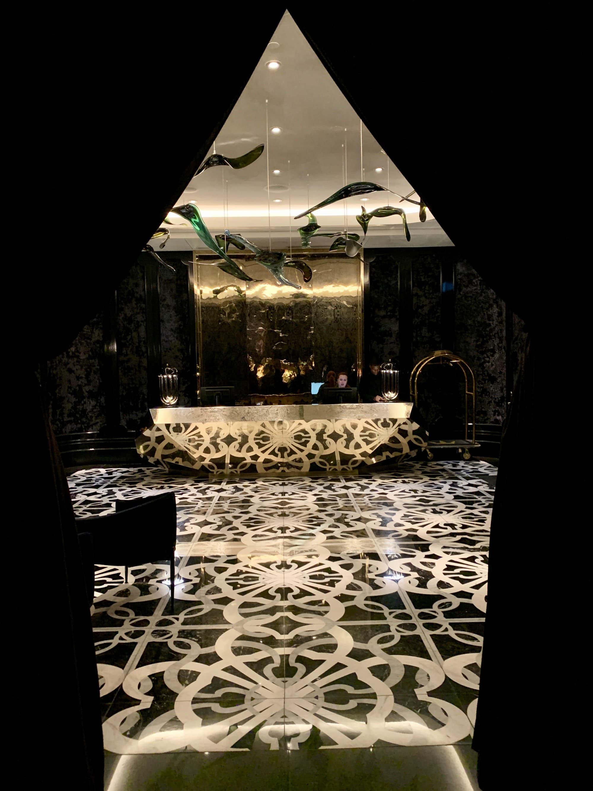 A view through curtains looking into the Bisha Hotel Toronto