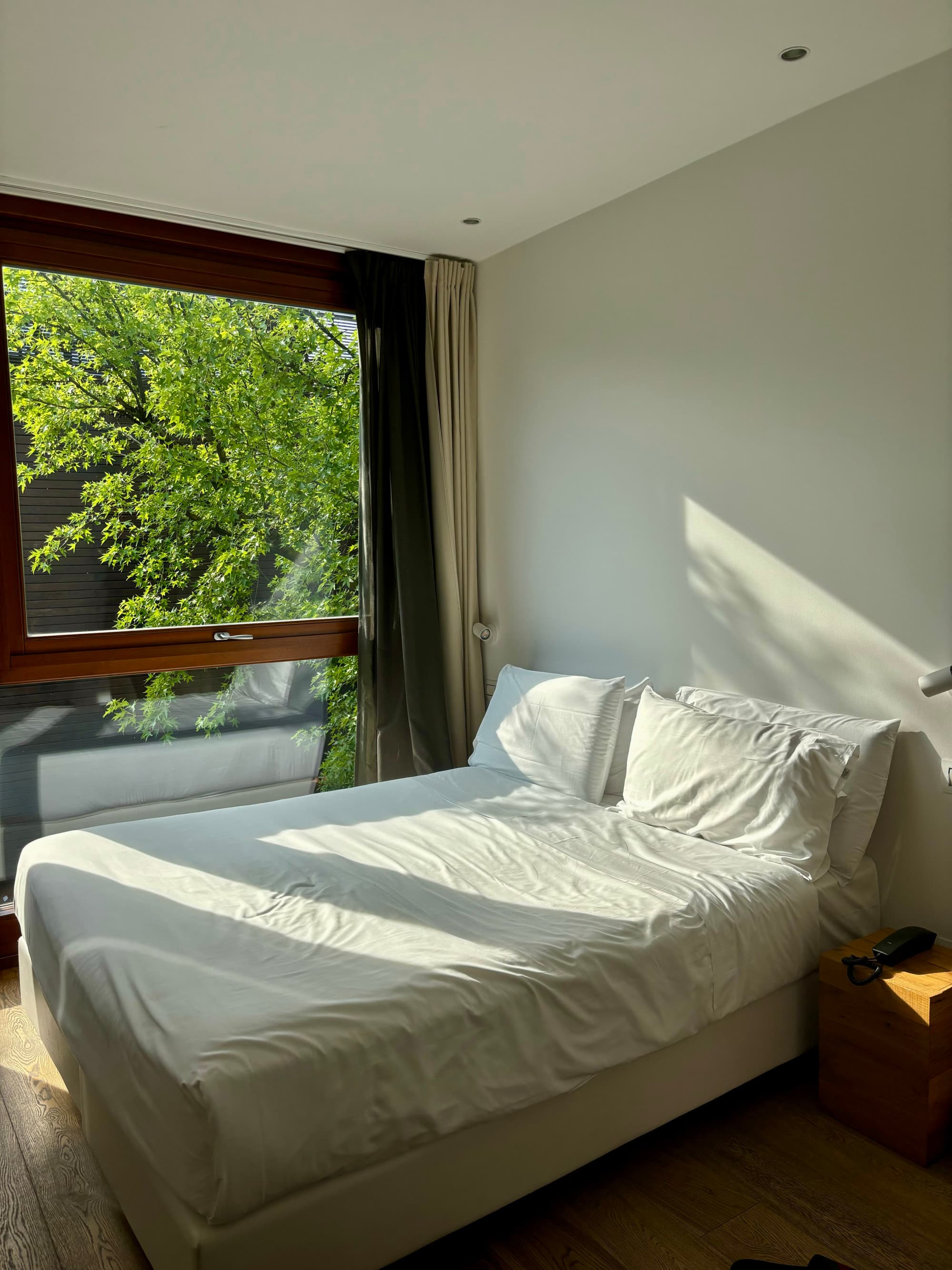 View of the room with floor-to-ceiling windows.
