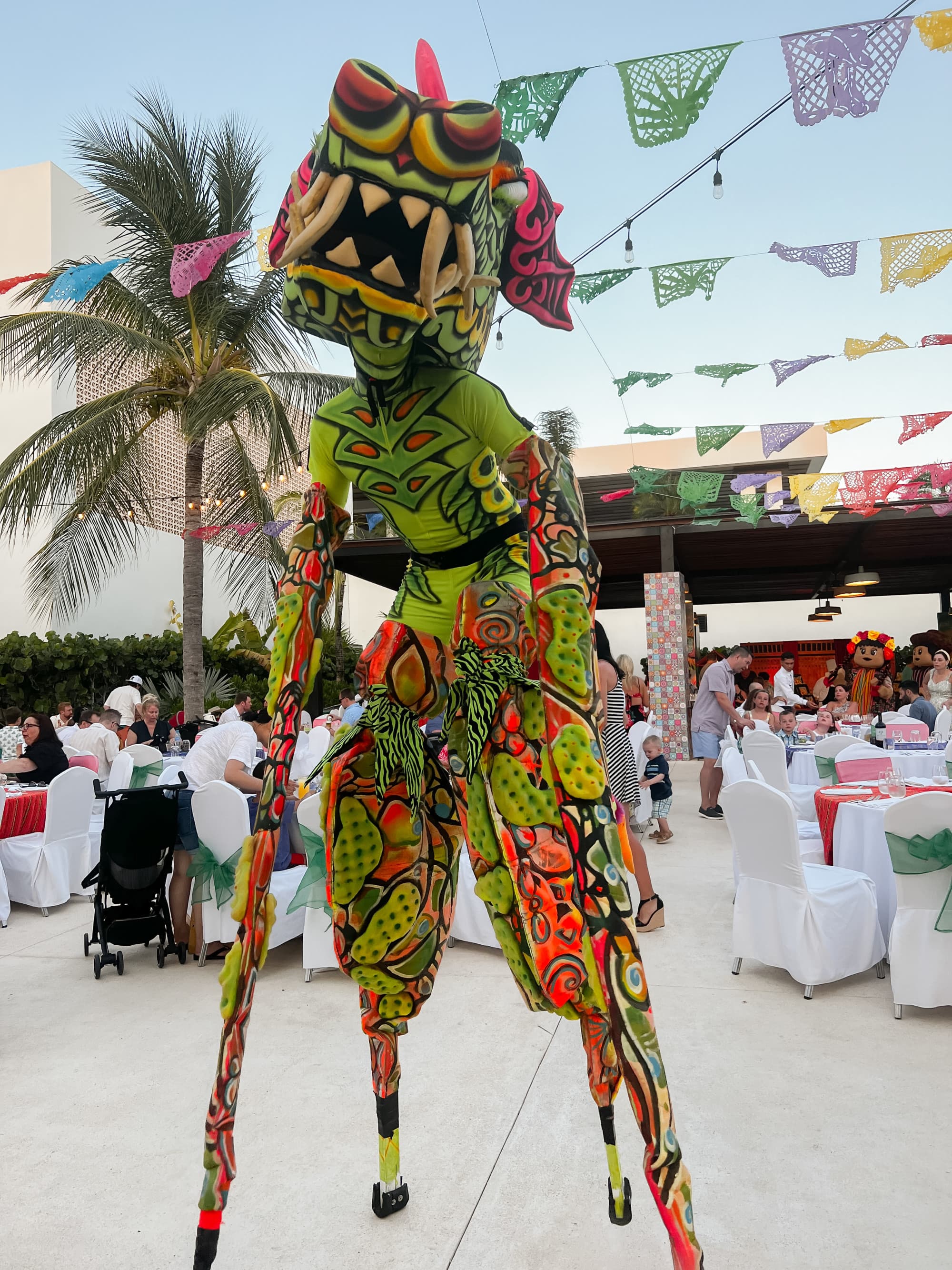 Fantasy costume character actor on stilts.