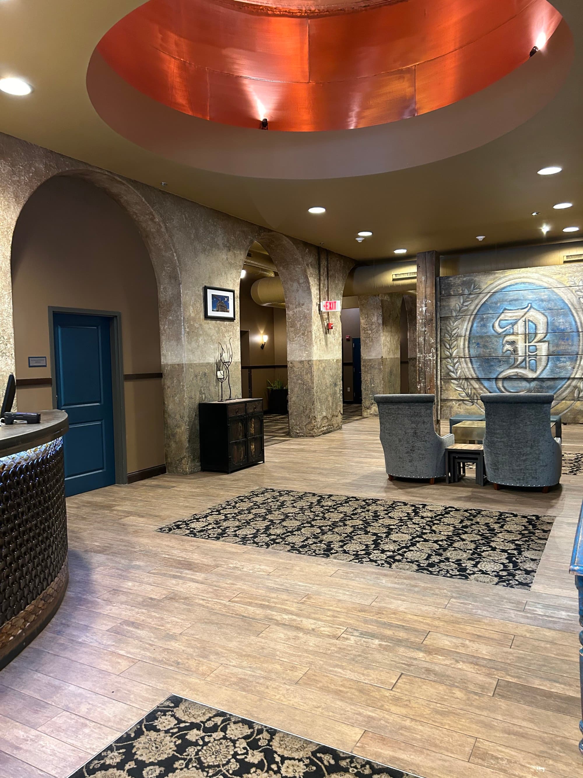 A well-lit domed lobby with modern amenities and lighting.