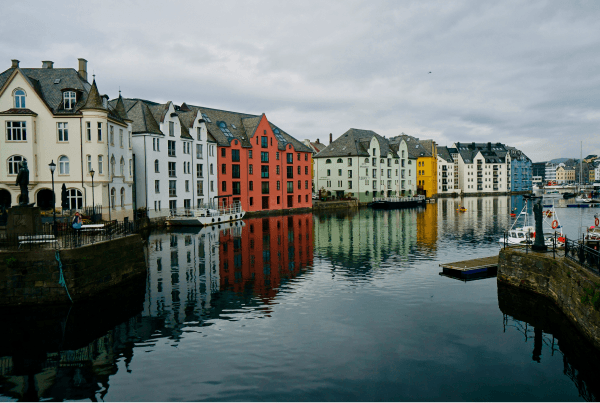 Colorful houses along a canal in Alesund Norway - Leah Chen