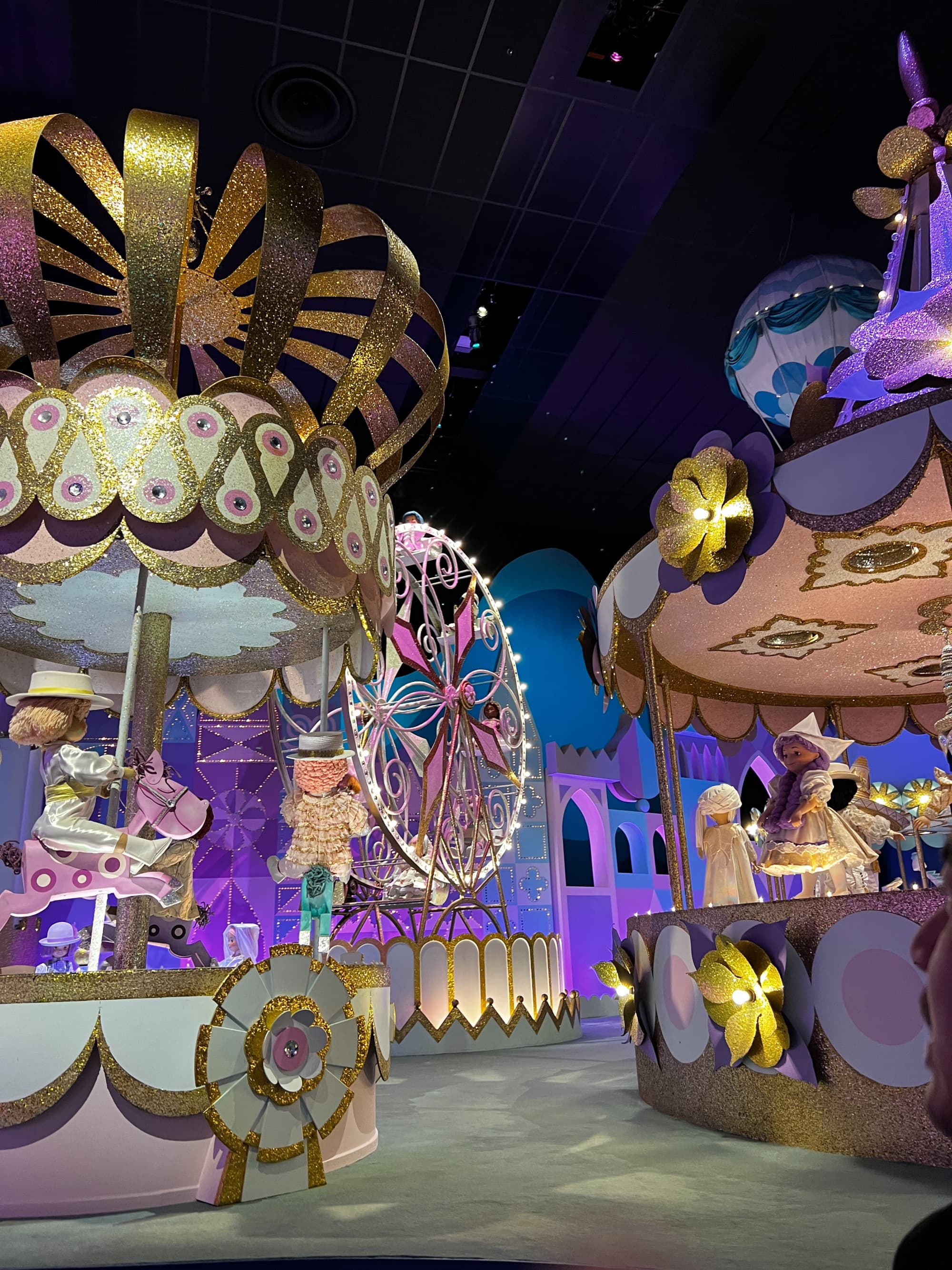 Disneyland Paris theme ride with animatronic figures on a merry-go-round.