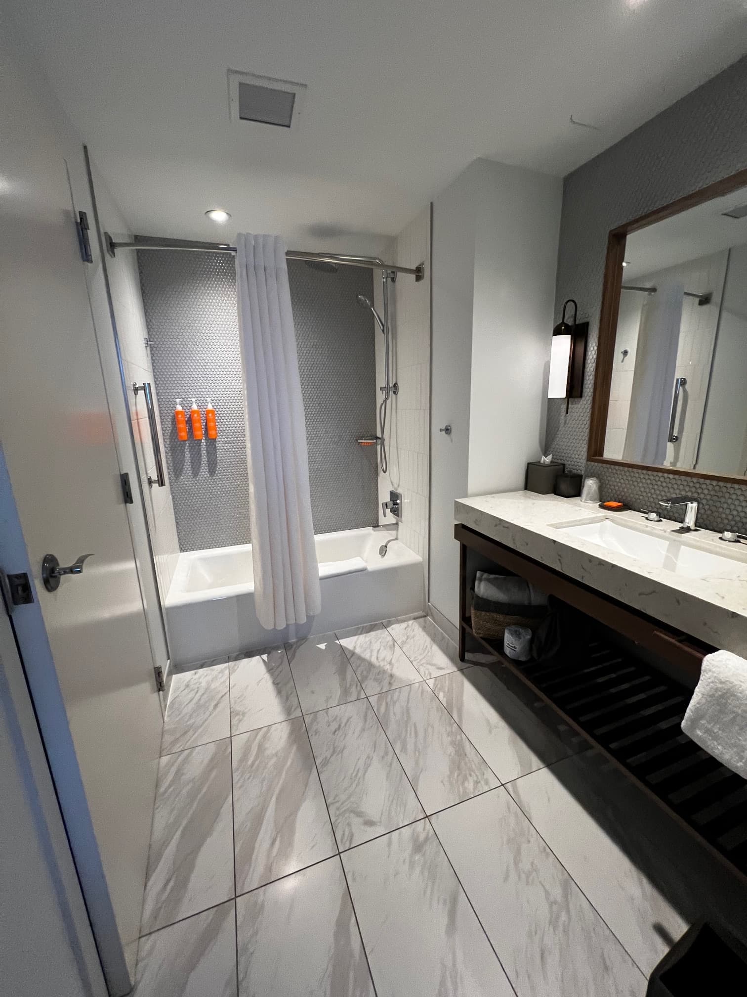 Powder room with marble floors.