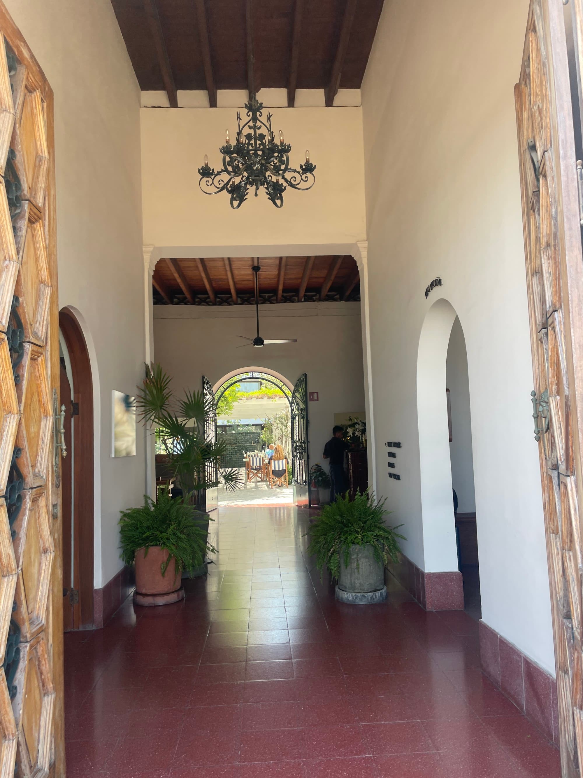 Hotel lobby with red tile floors.