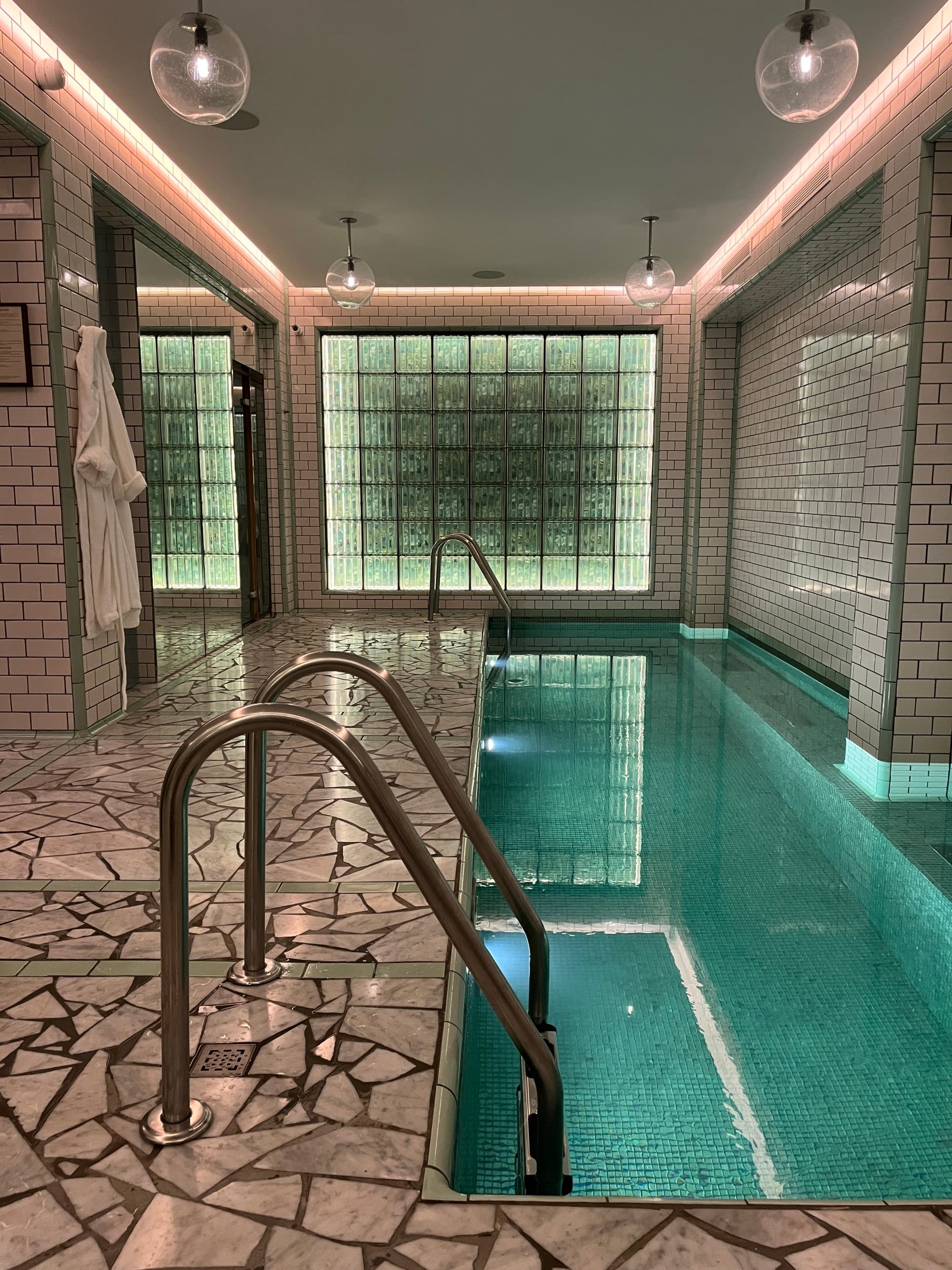 Indoor pool that is long and narrow.