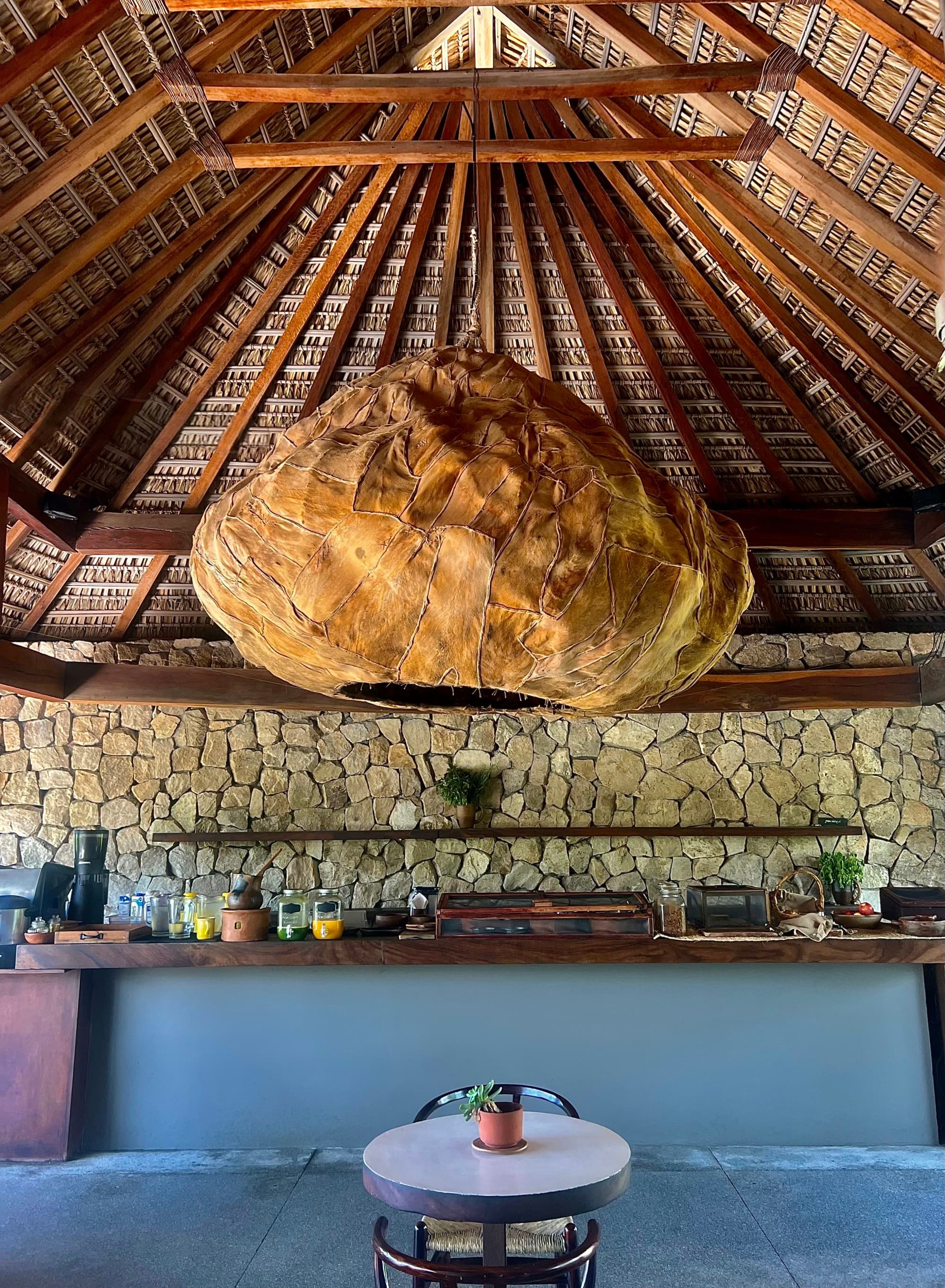 Large pendant lamp and small table.