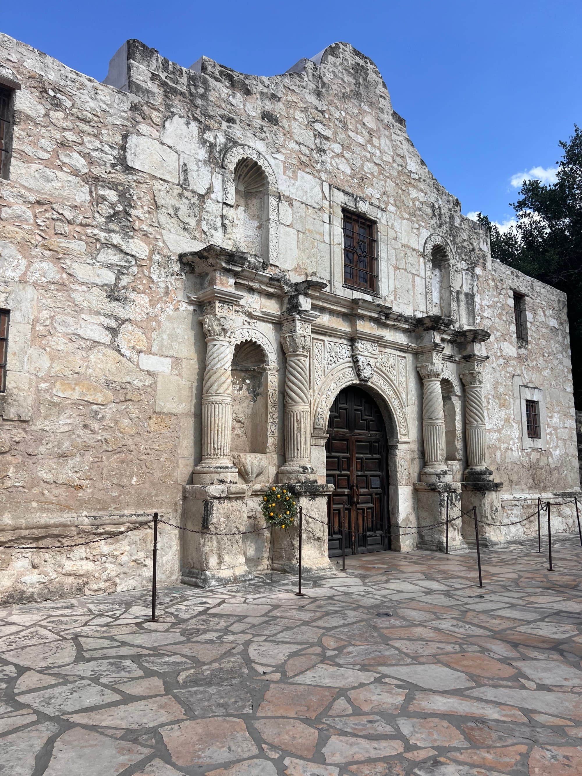The outside of a historic stone building during the daytime
