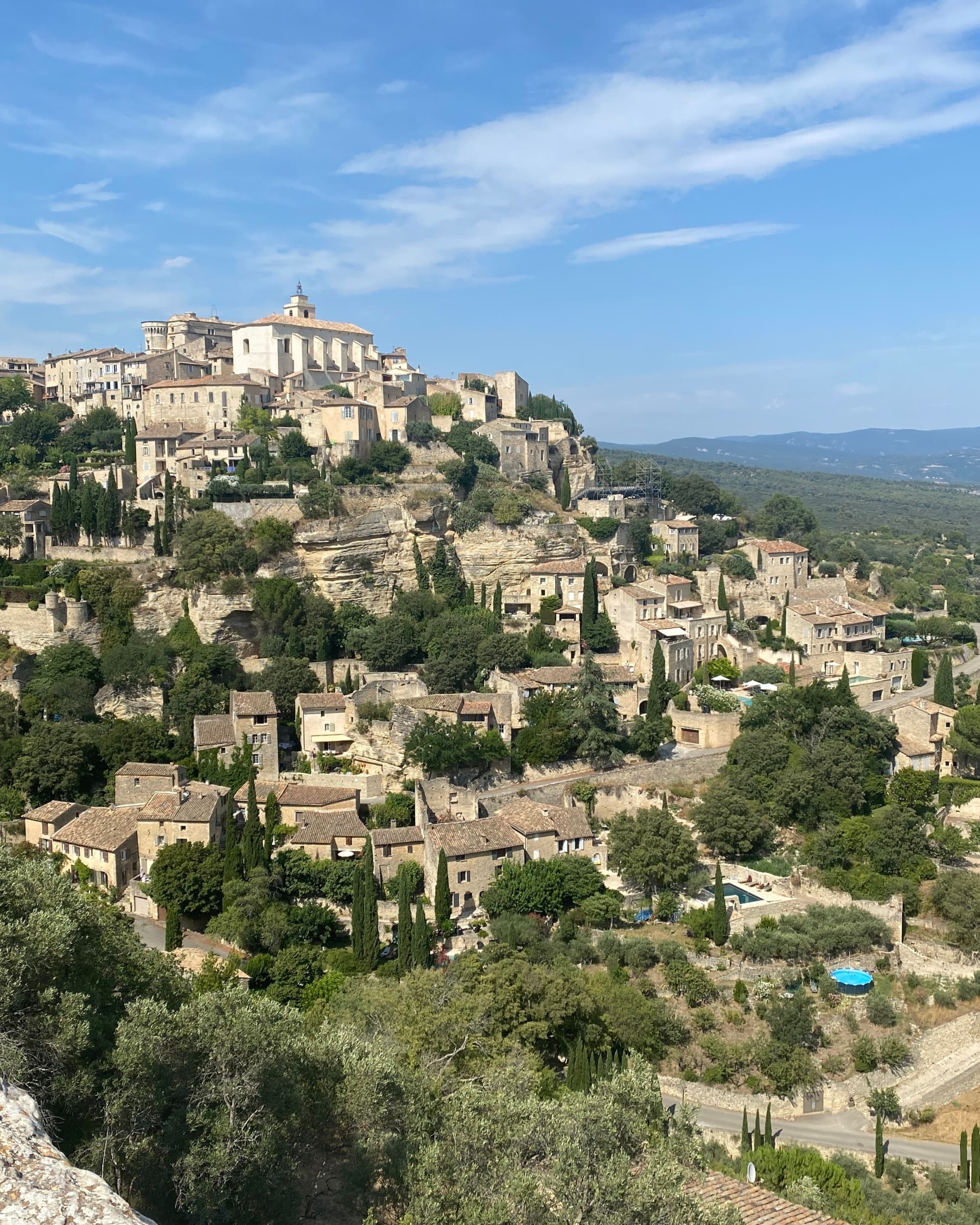A view of a hillside village during the daytime