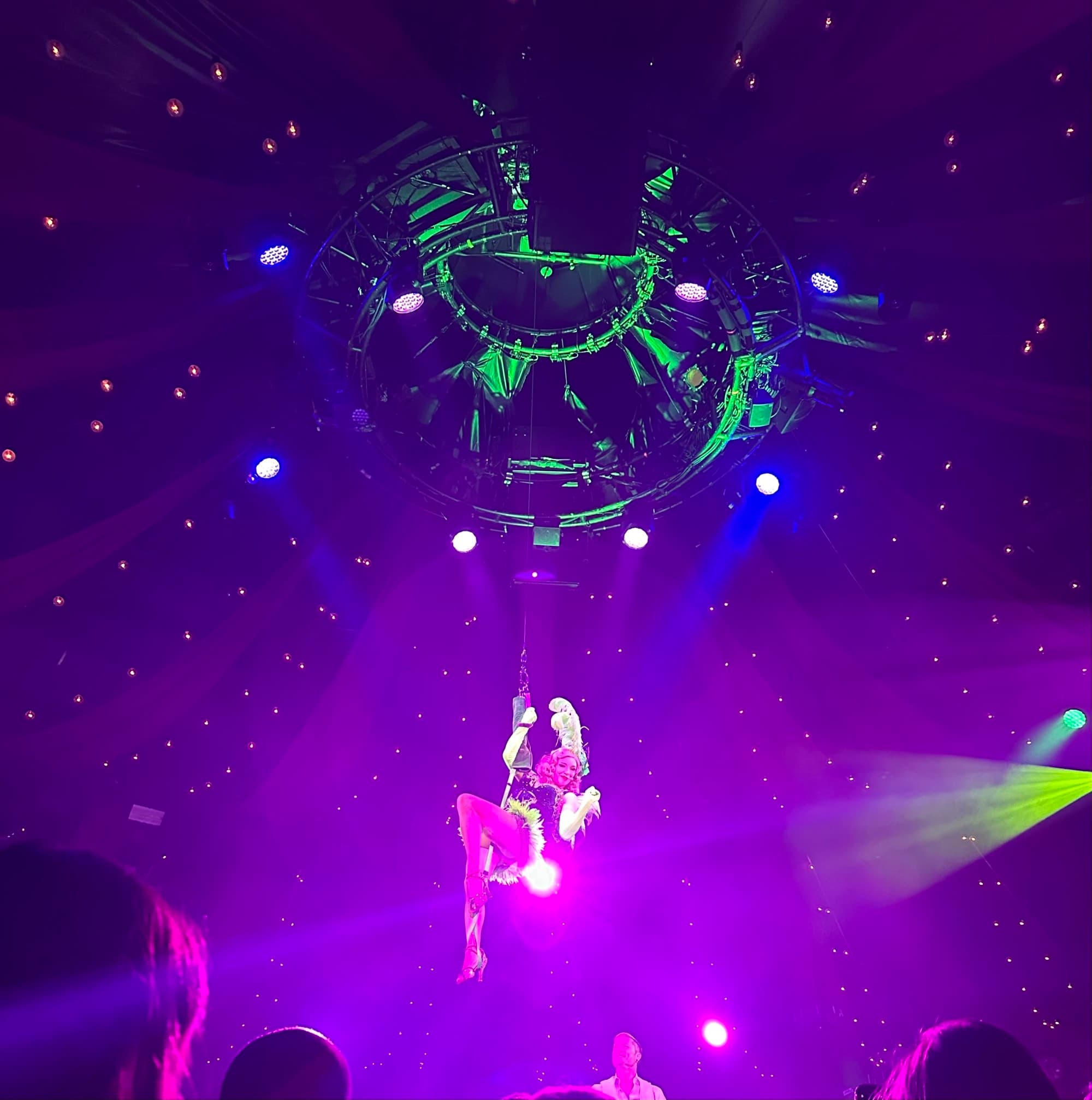A stage with lights and a dancer.