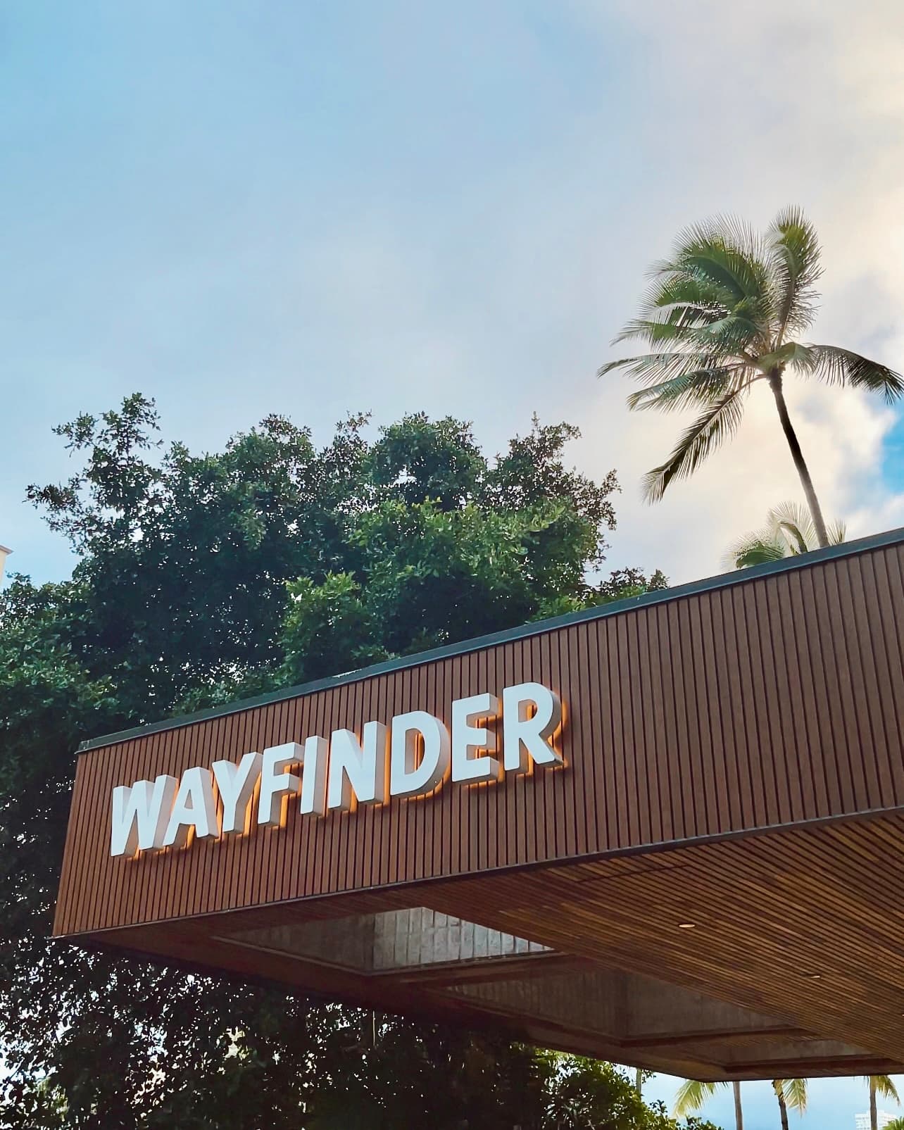 A building with a sign reading "WAYFINDER" at the top