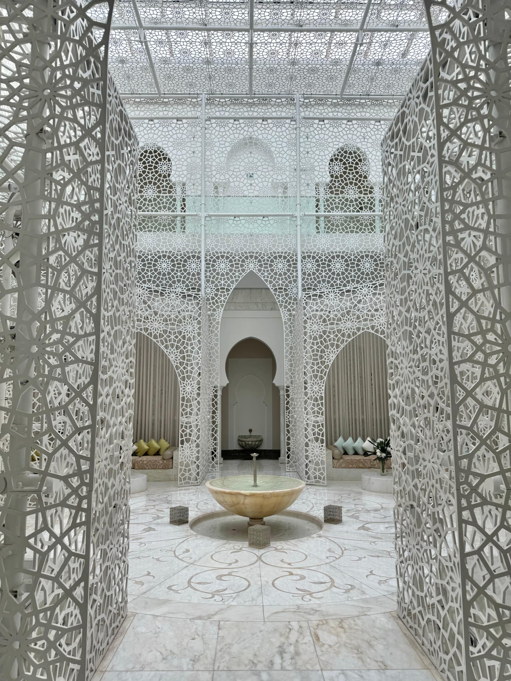 An entrance to a glass-walled courtyard area