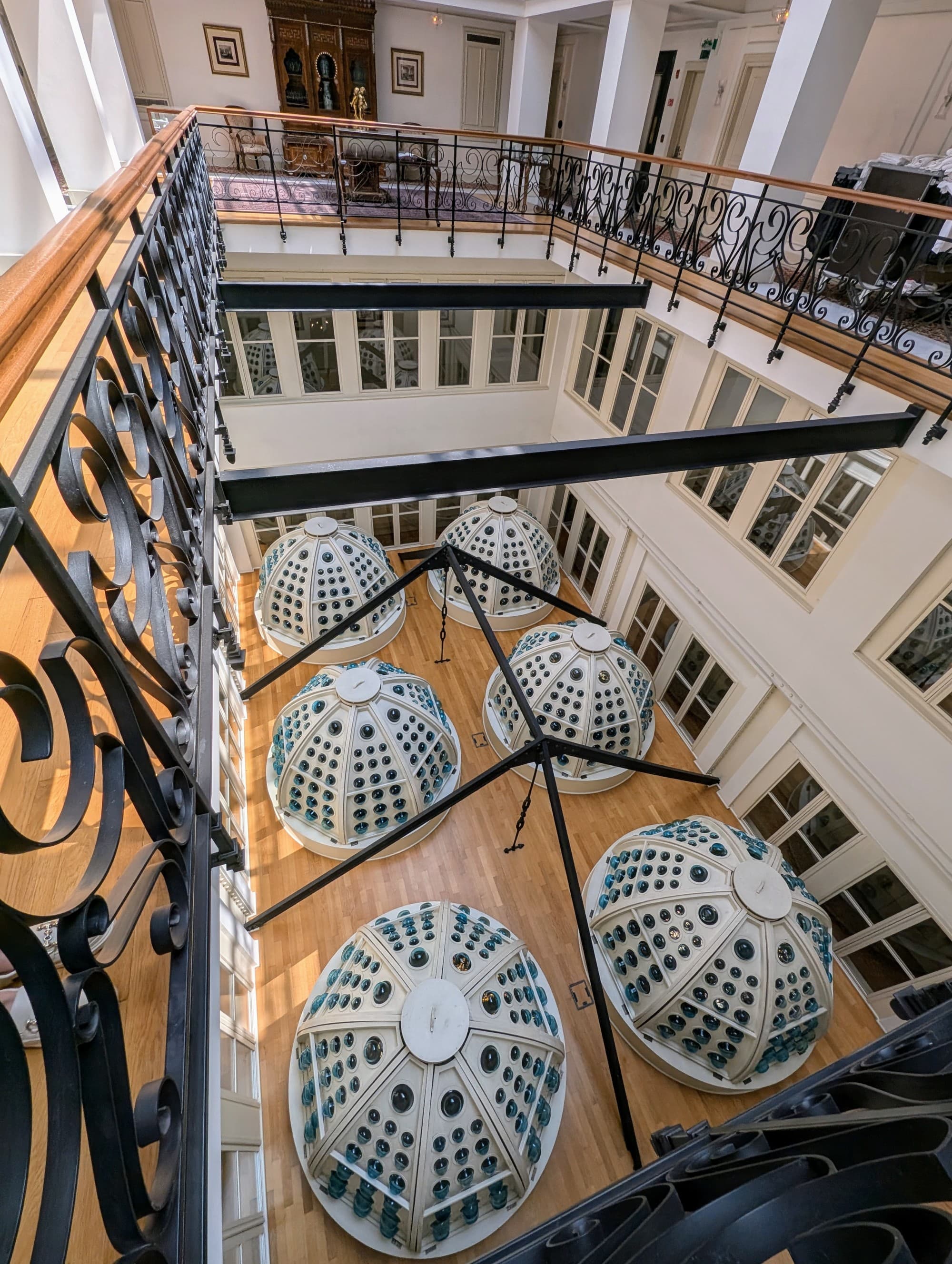 Domes viewed from above through a glass ceiling.