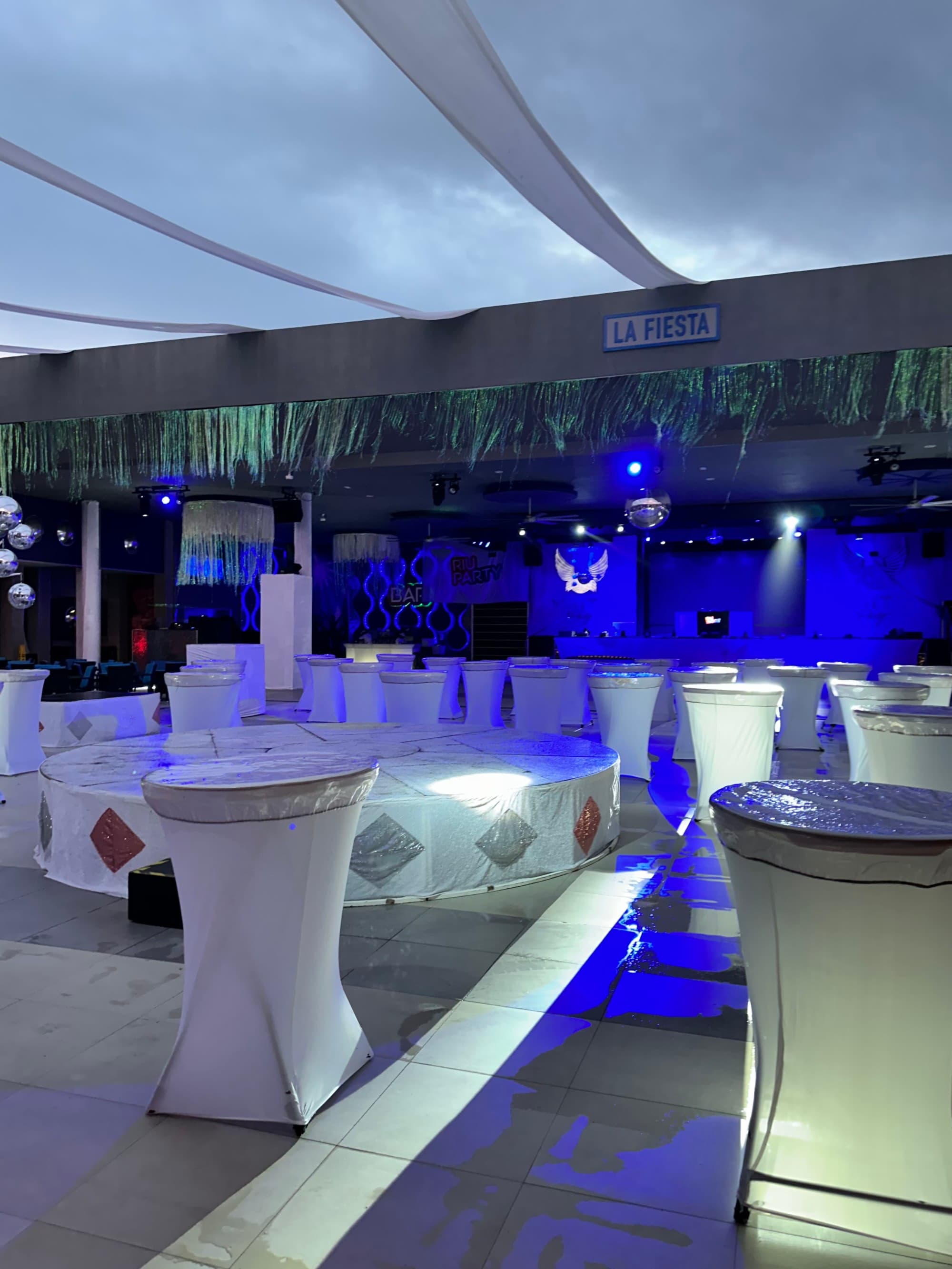 An indoor seating area in a dark-lit room