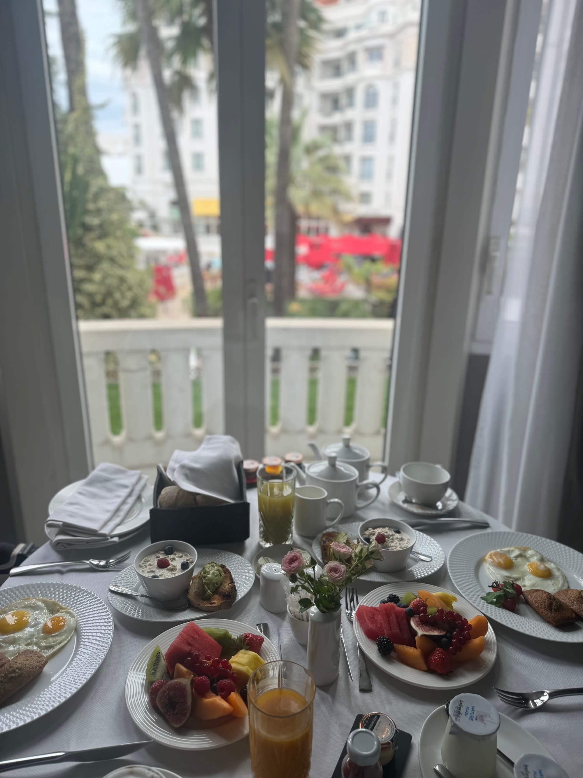 View of a set table with an assortment of breakfast foods.