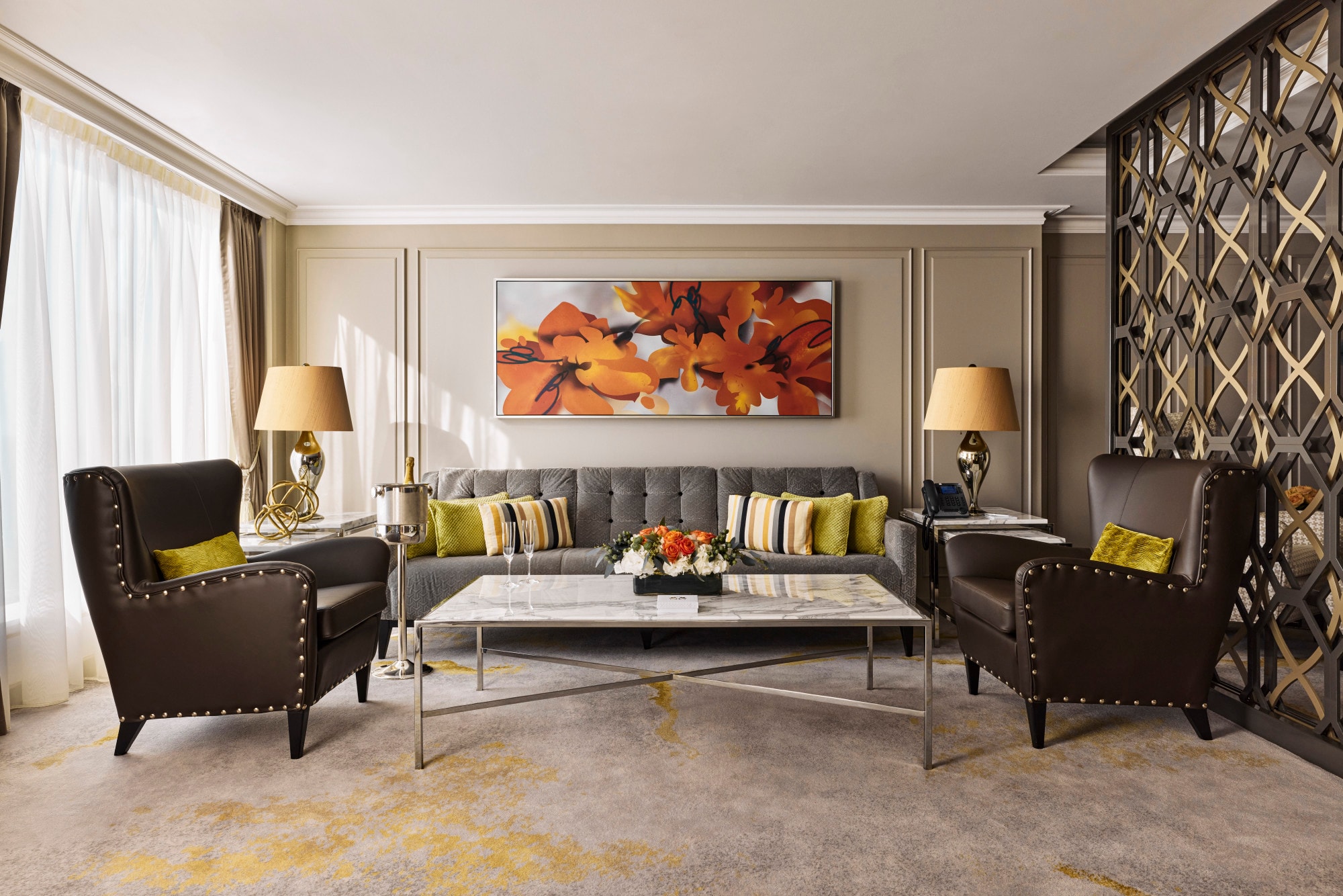 a chic living room with a painting of a red flower