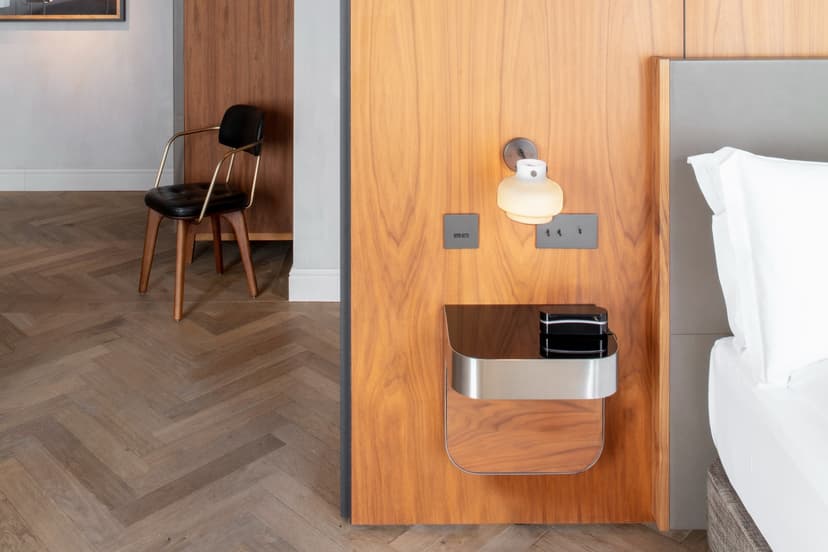 a bed against a wooden headboard