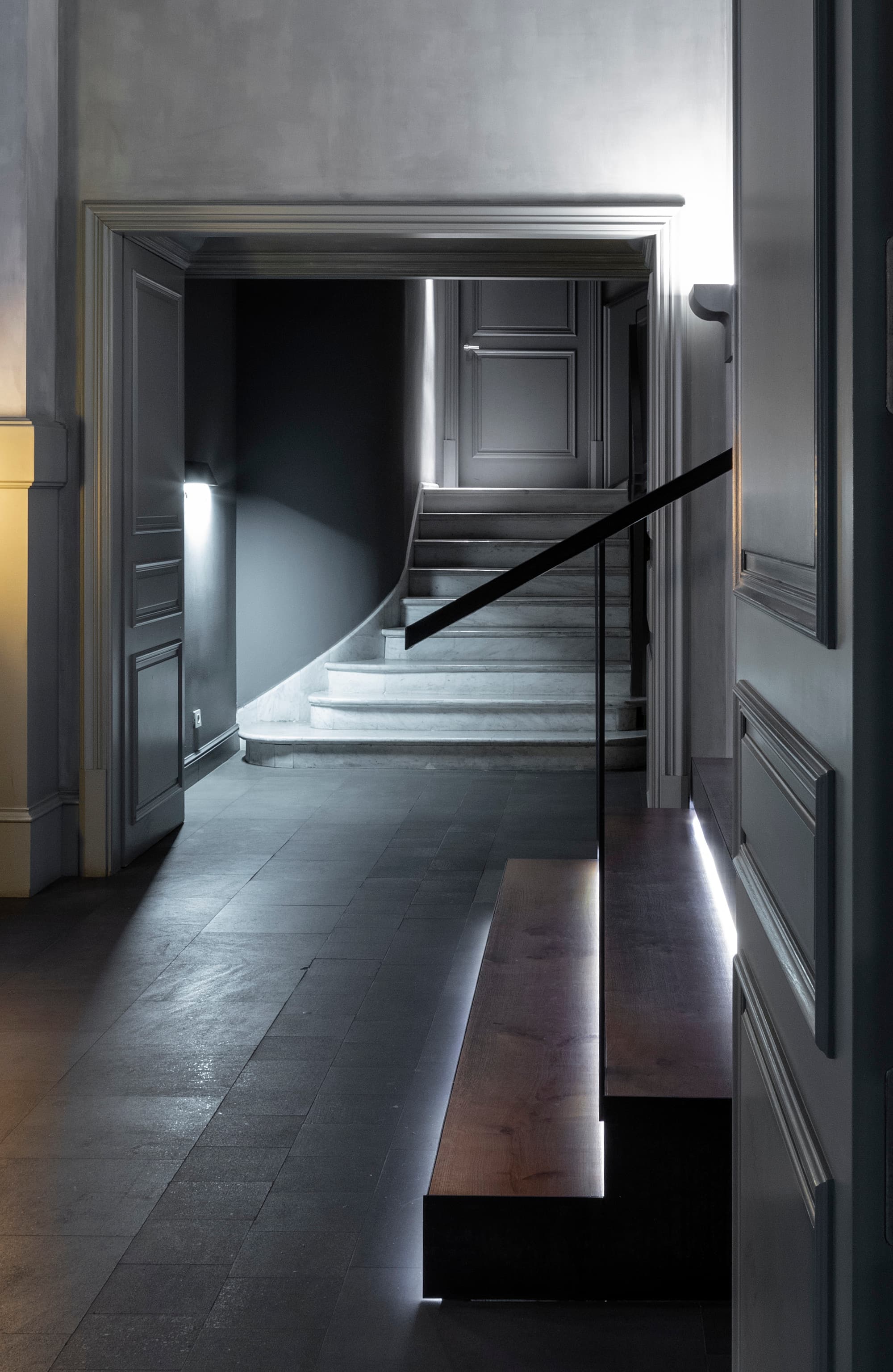 a dimly lit gray entryway