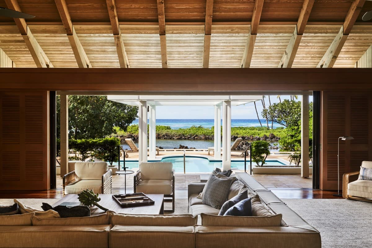 open-air living room overlooking a private plunge pool and the ocean