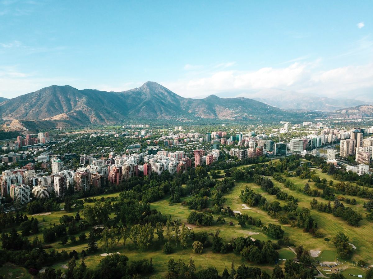 City buildings under a mountain range