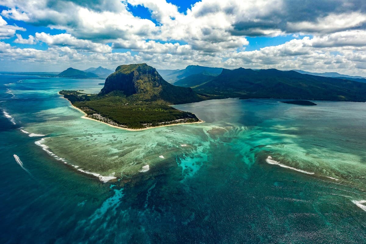 Green island in the middle of a body of water