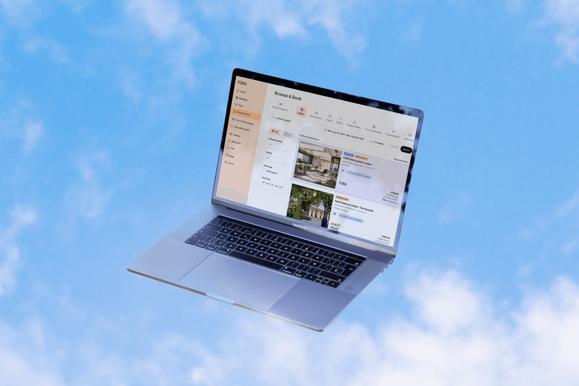 laptop against a sky background