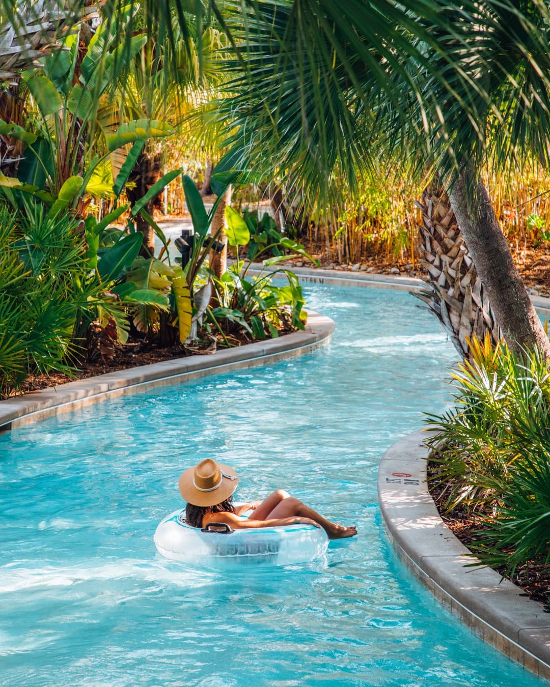 Travel advisor posing in a pool
