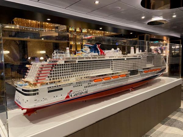 A model of the cruise ship Carnival Jubilee in a glass case.