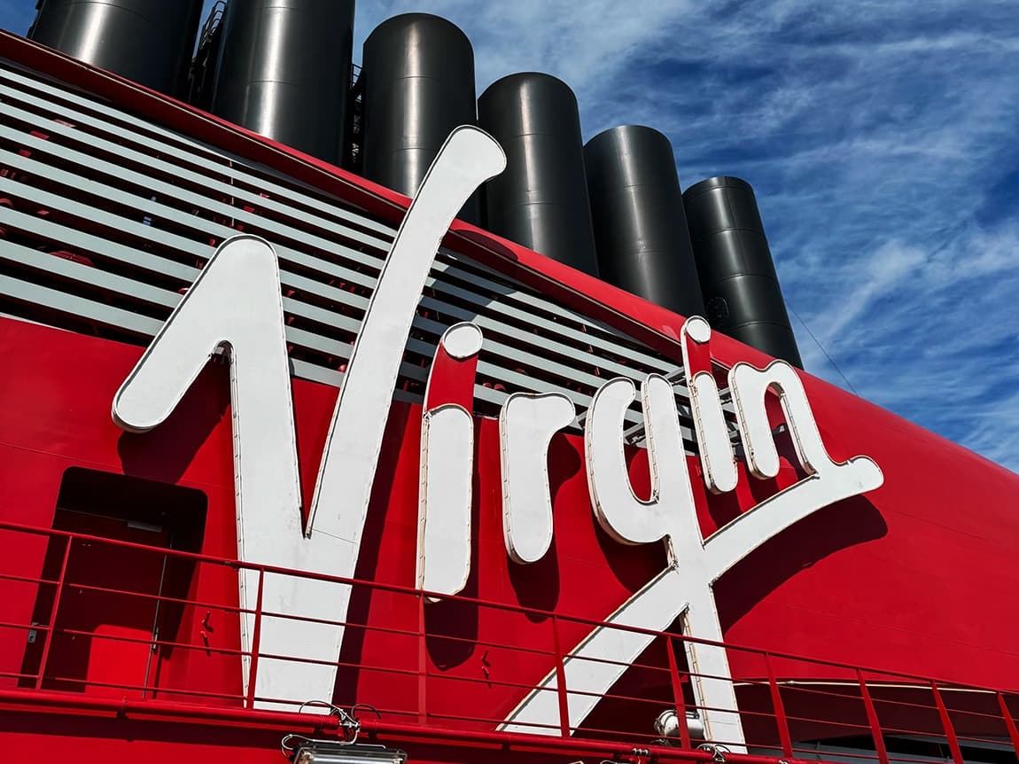 The word "Virgin" in white lettering against a red background