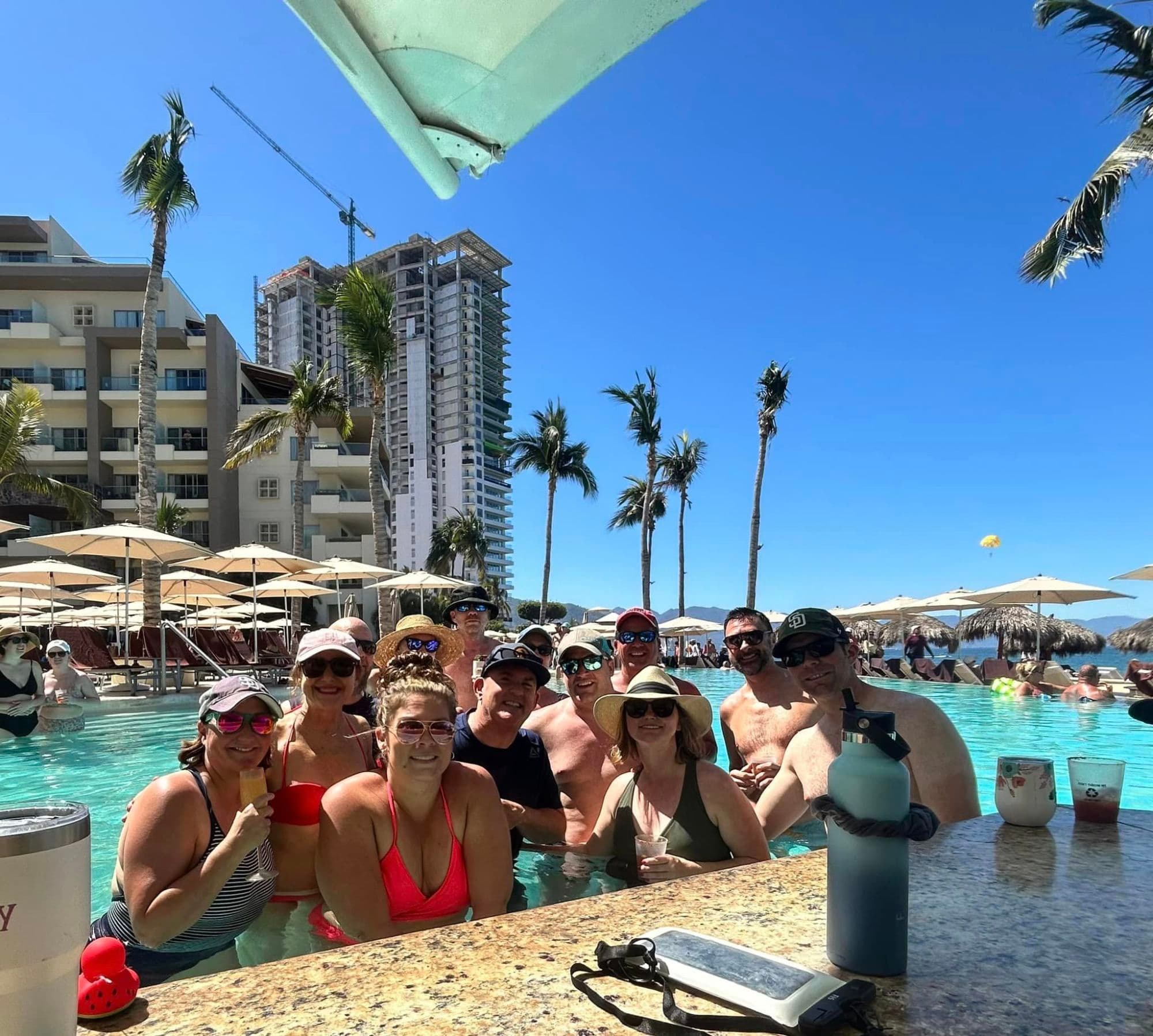 Group of people posing in a pool