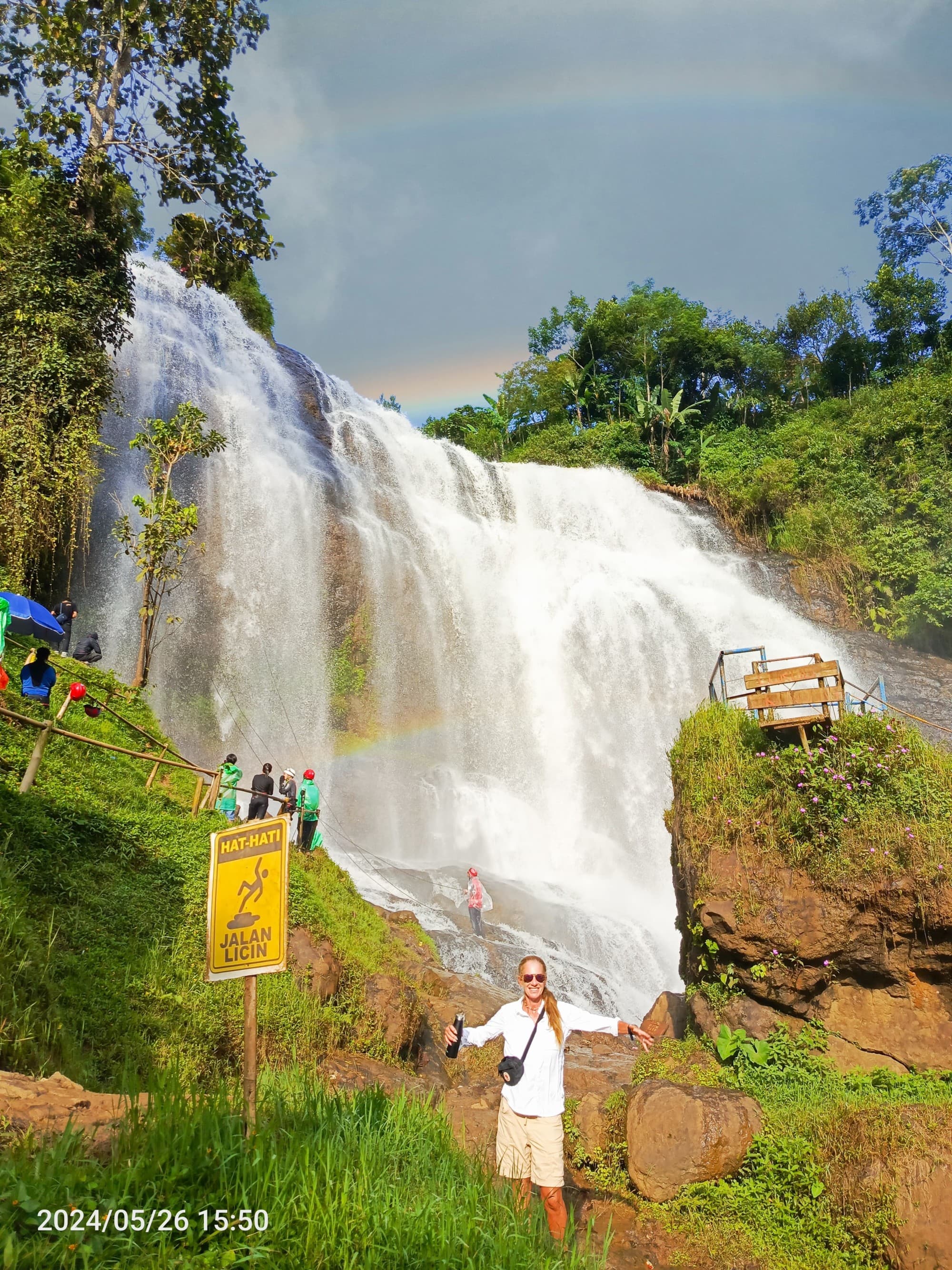 Triple rainbow over a waterfall.