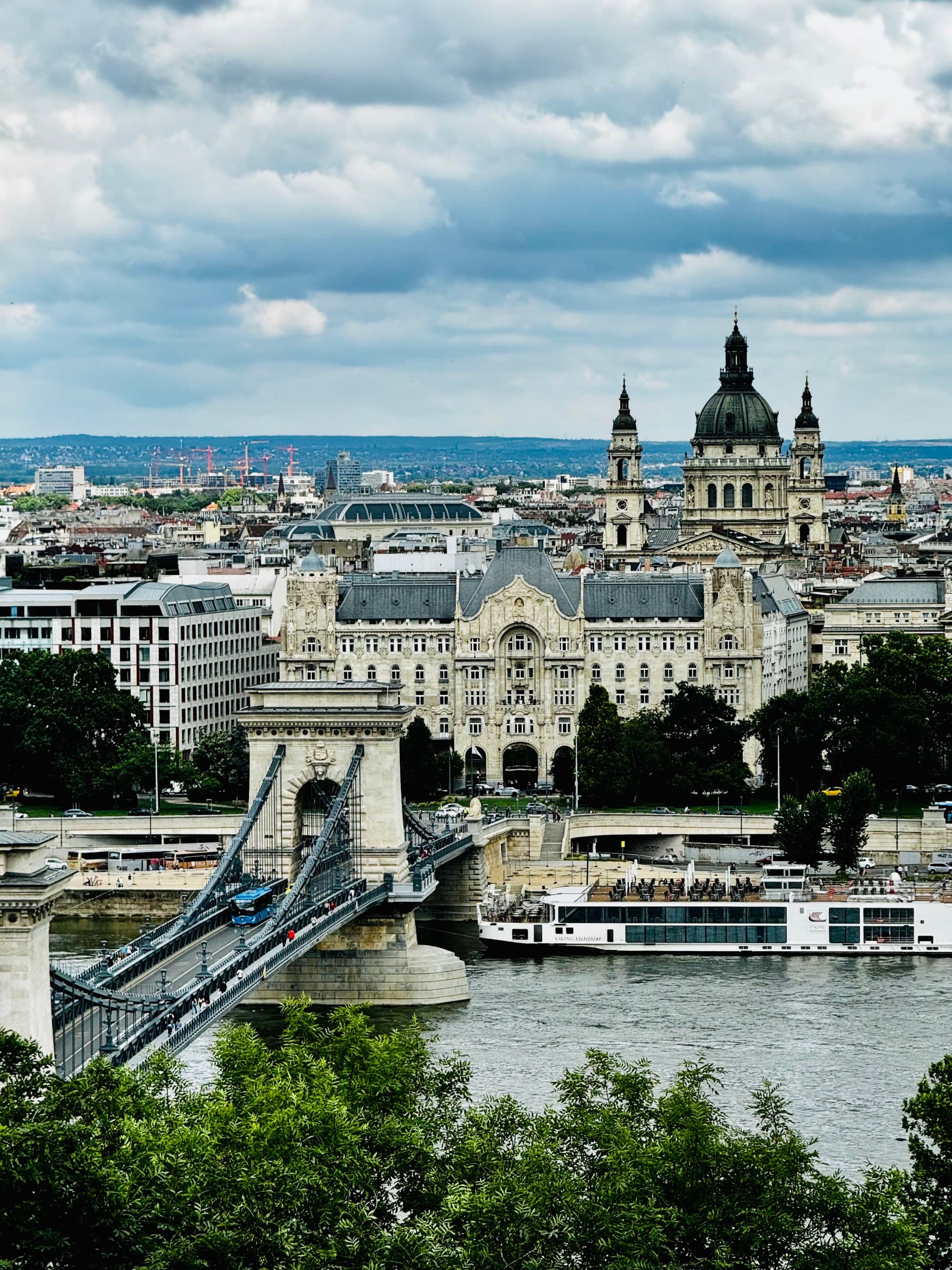 Historic bridge and buildings in Budapest.