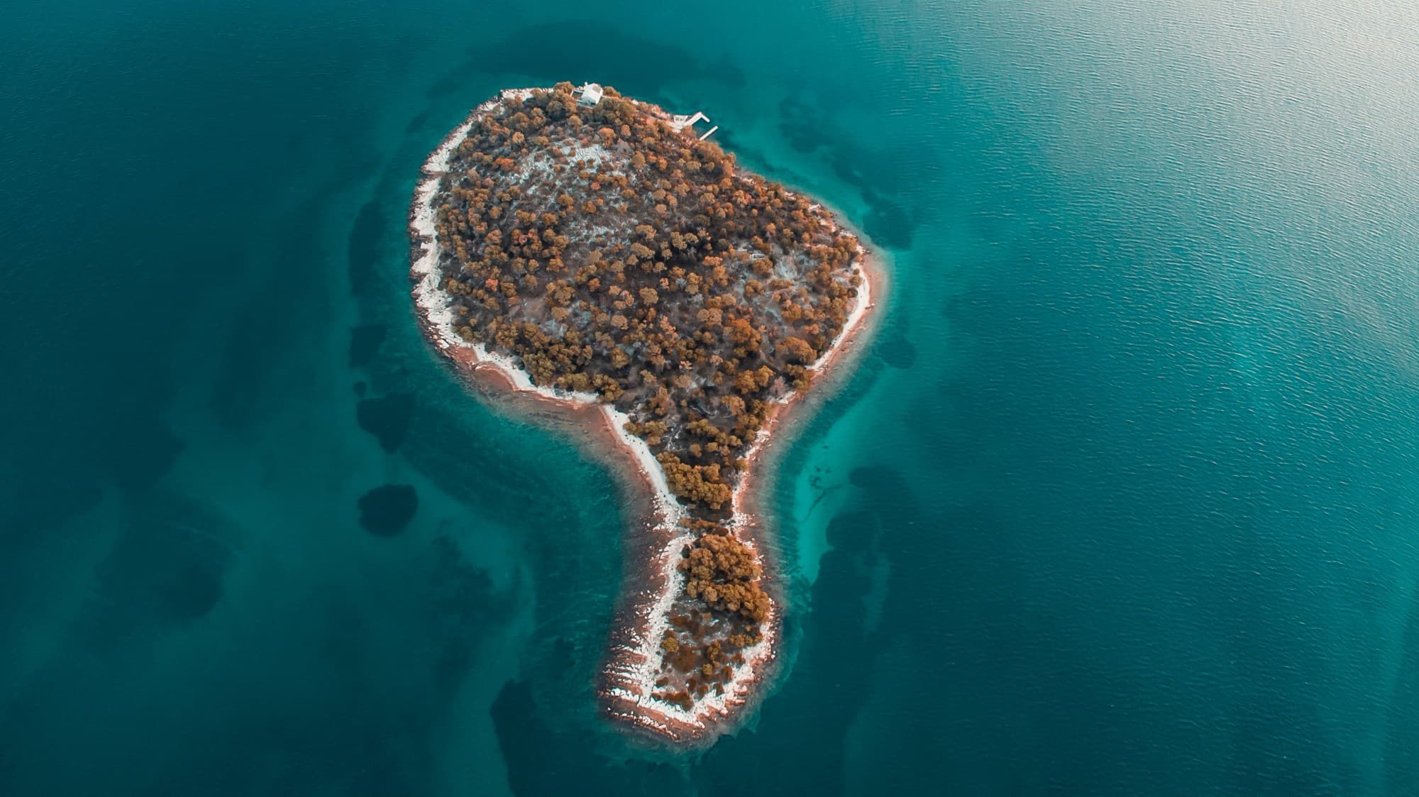 An aerial view of an island in Croatia in the middle of the ocean.