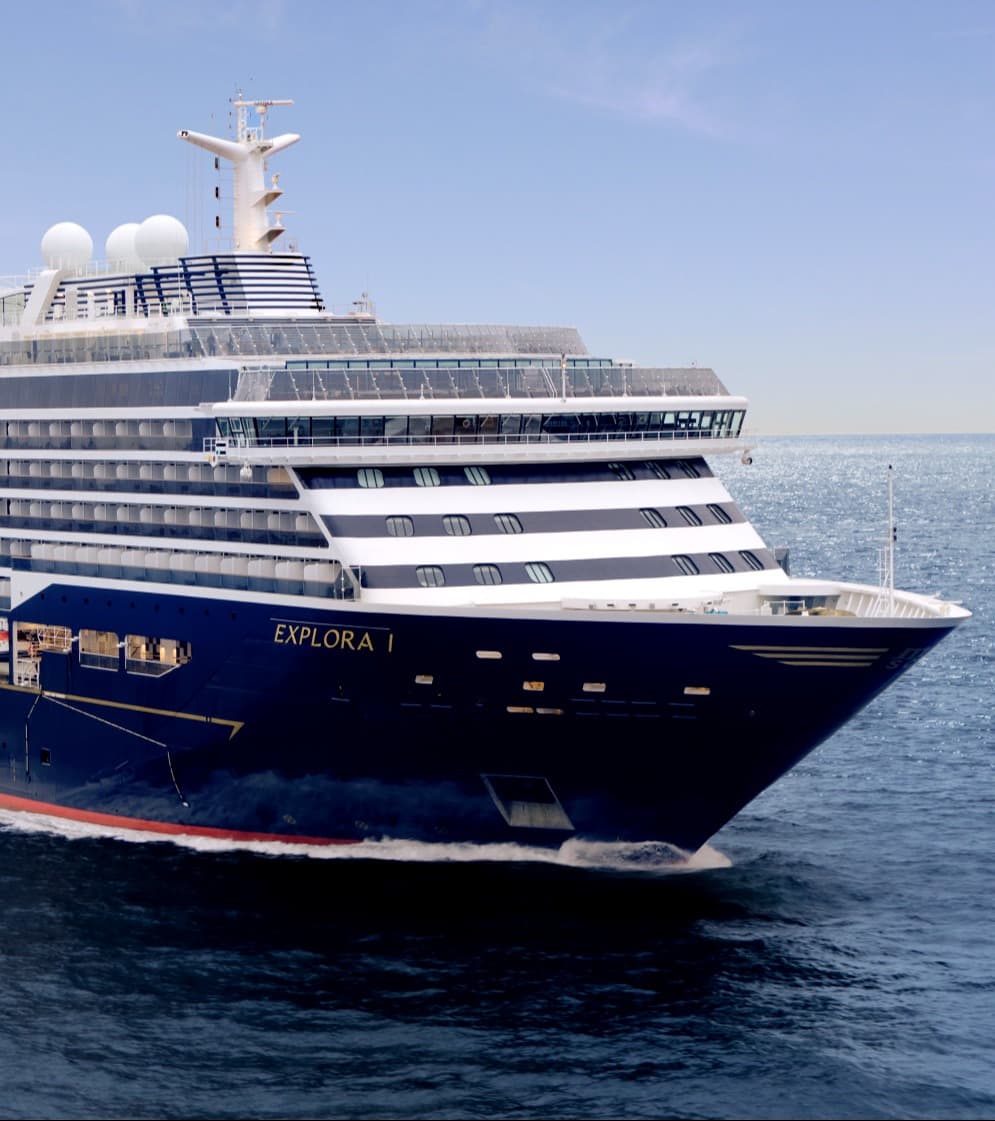 The blue and white Explora I ship in open water - Alex Sallis