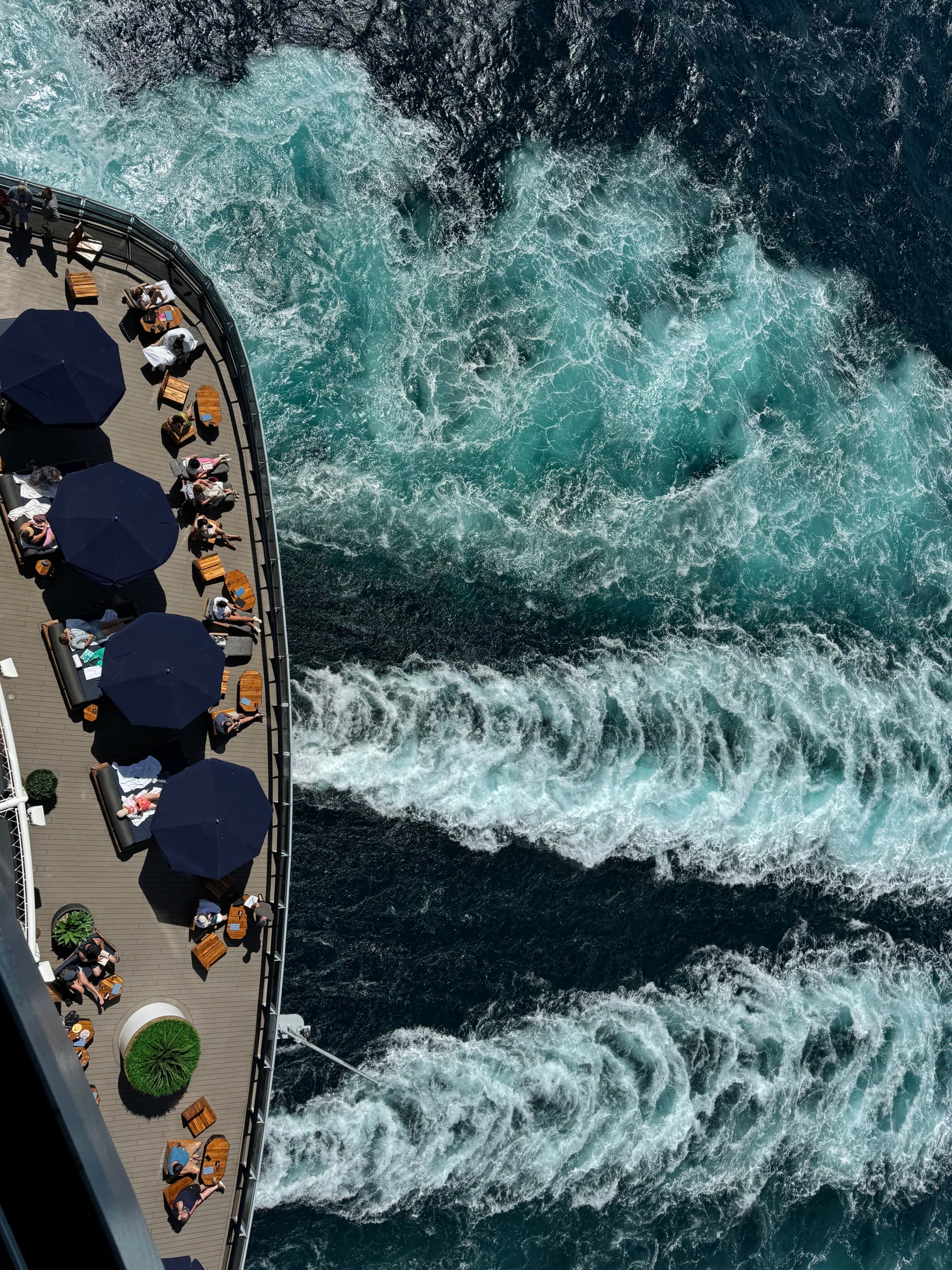 A view from above of a cruise ship sailing in the water