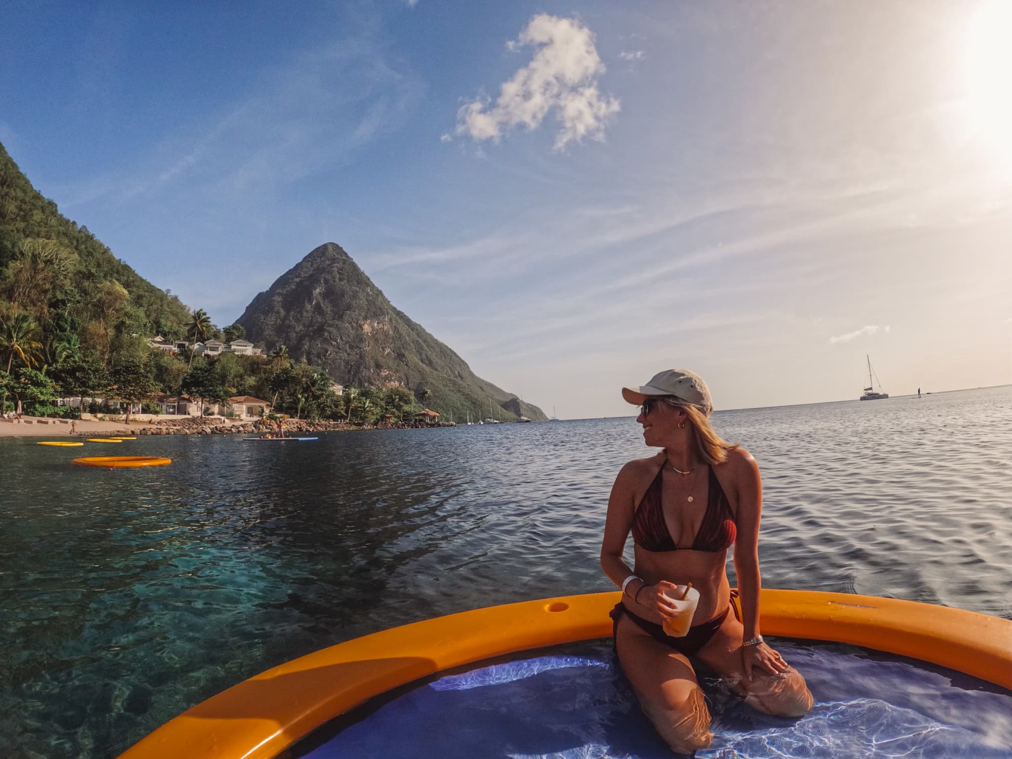 A woman posing on a boat in the water