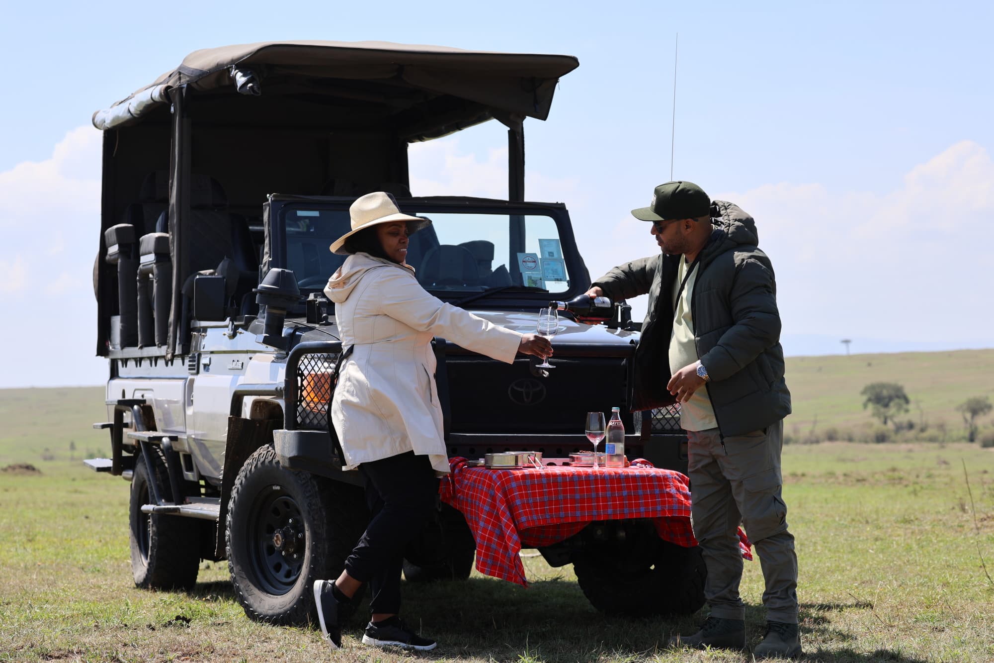 Travel advisor standing beside Jeep