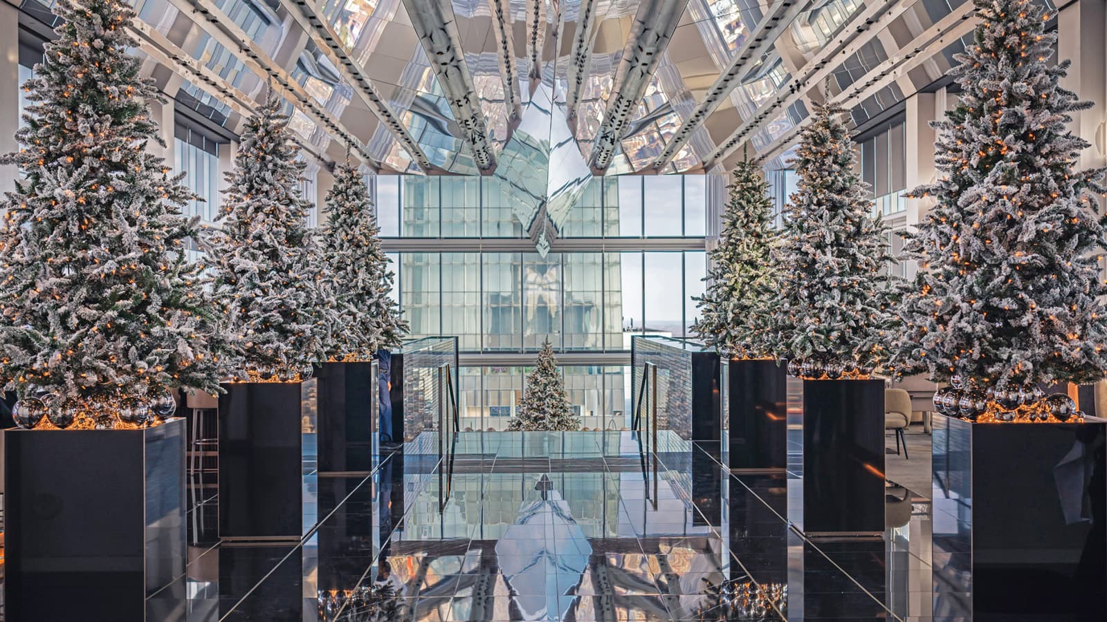 The interior of a hotel lobby with glass floors and ceilings