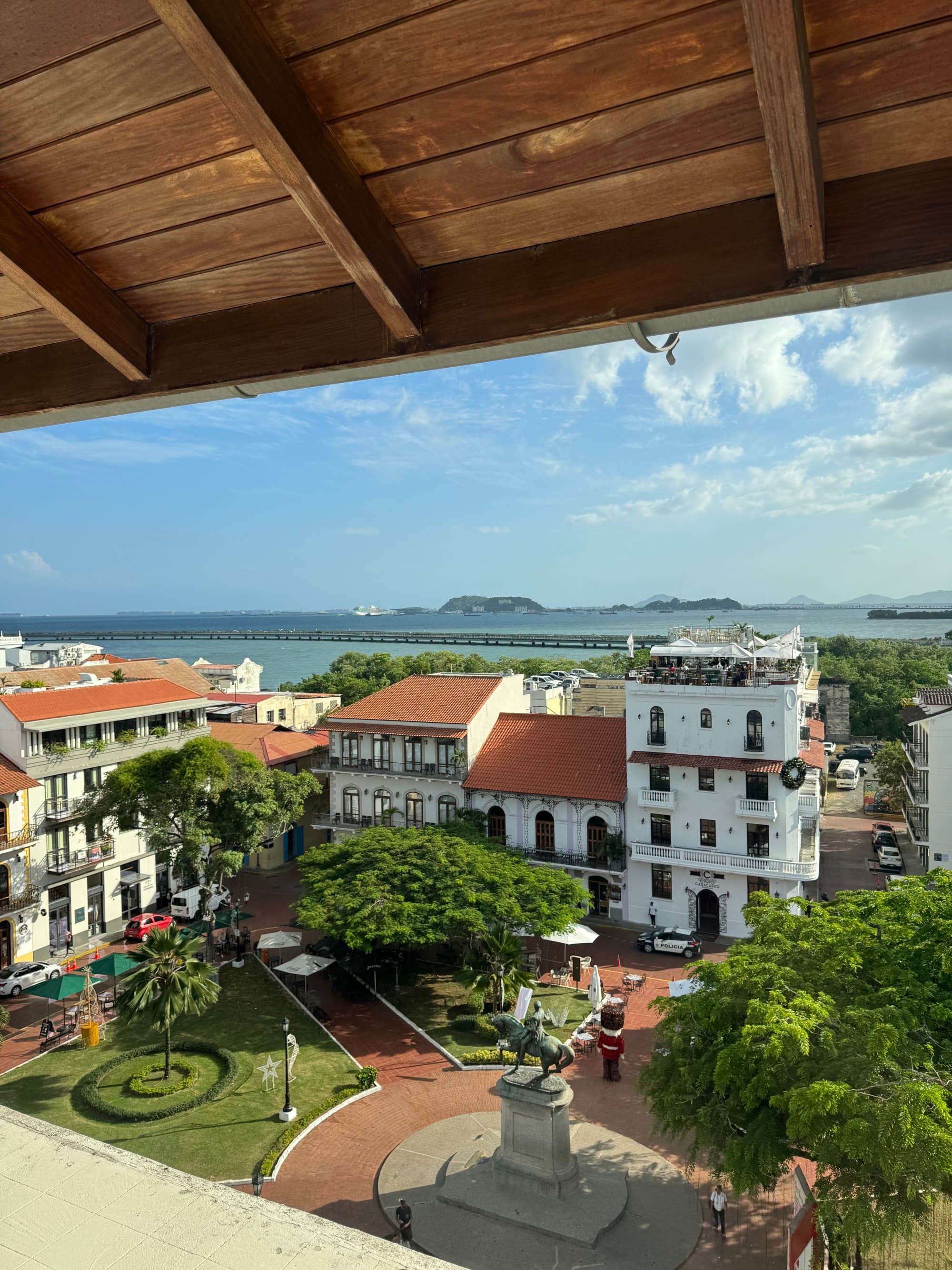 View from the hotel balcony with a beautiful courtyard and lots of foliage in the surrounding areas.