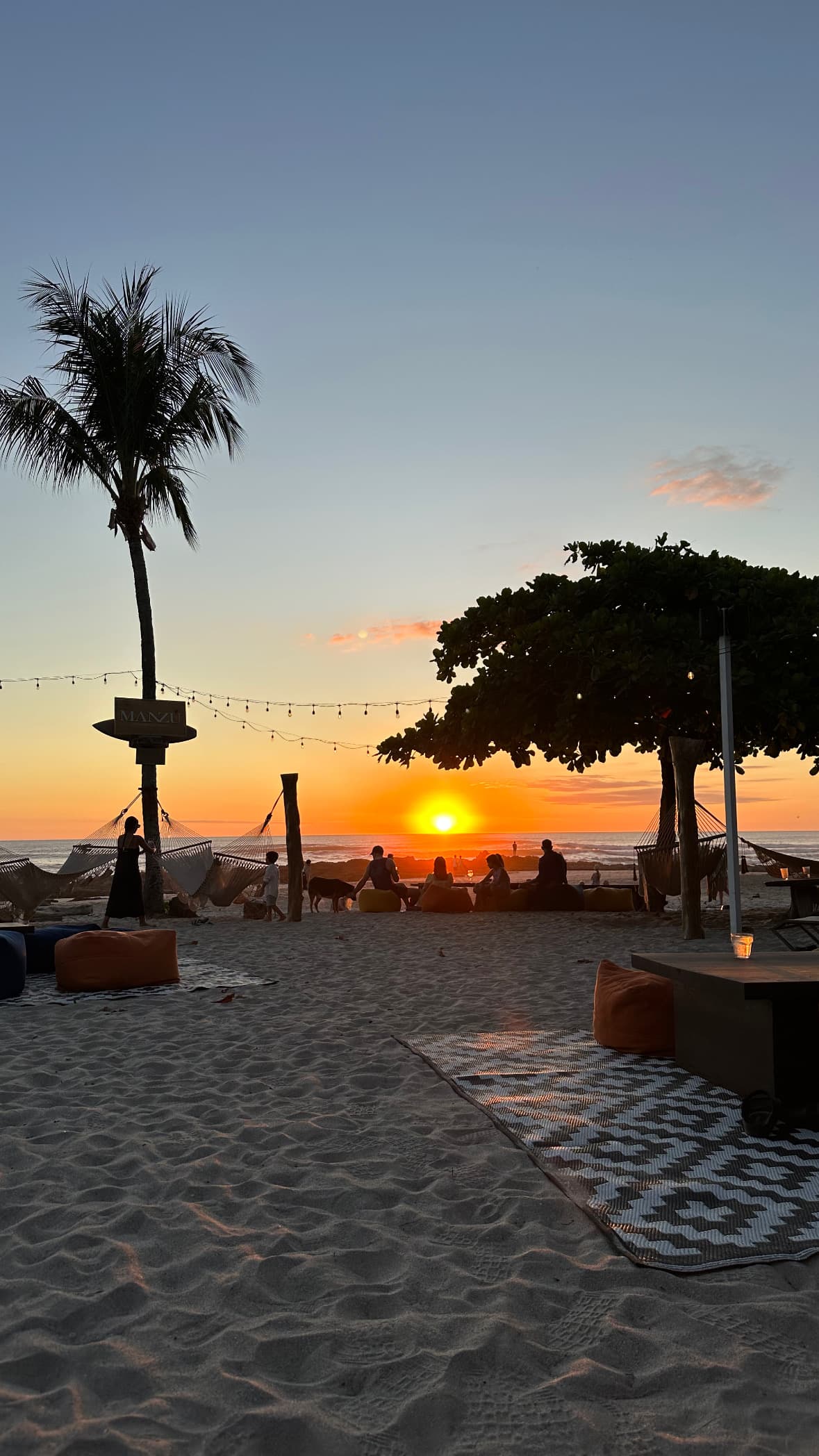 A view of a sunset at the beach.