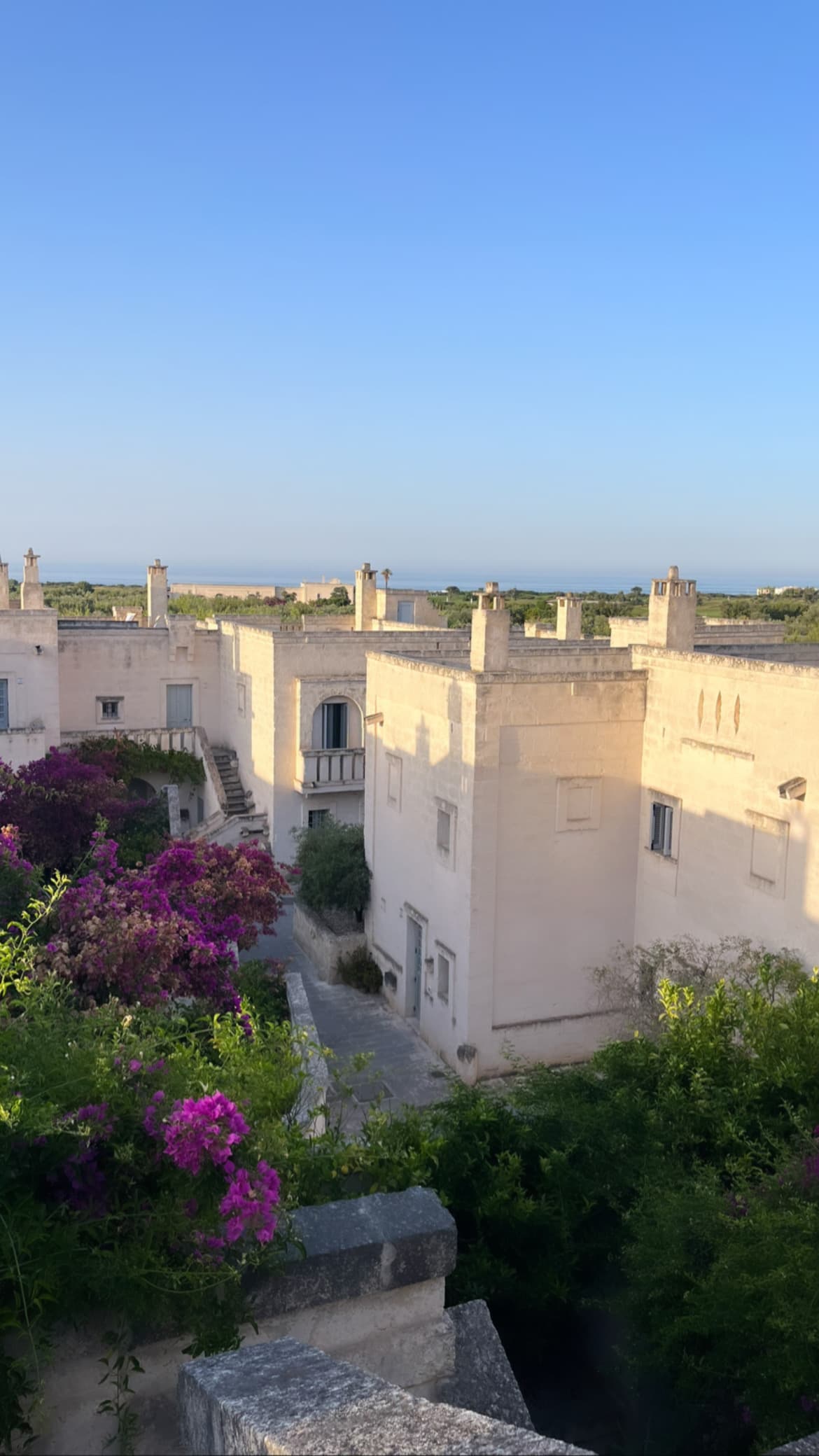 Beautiful view of the white buildings of Borgo Egnazia hotel on a sunny day