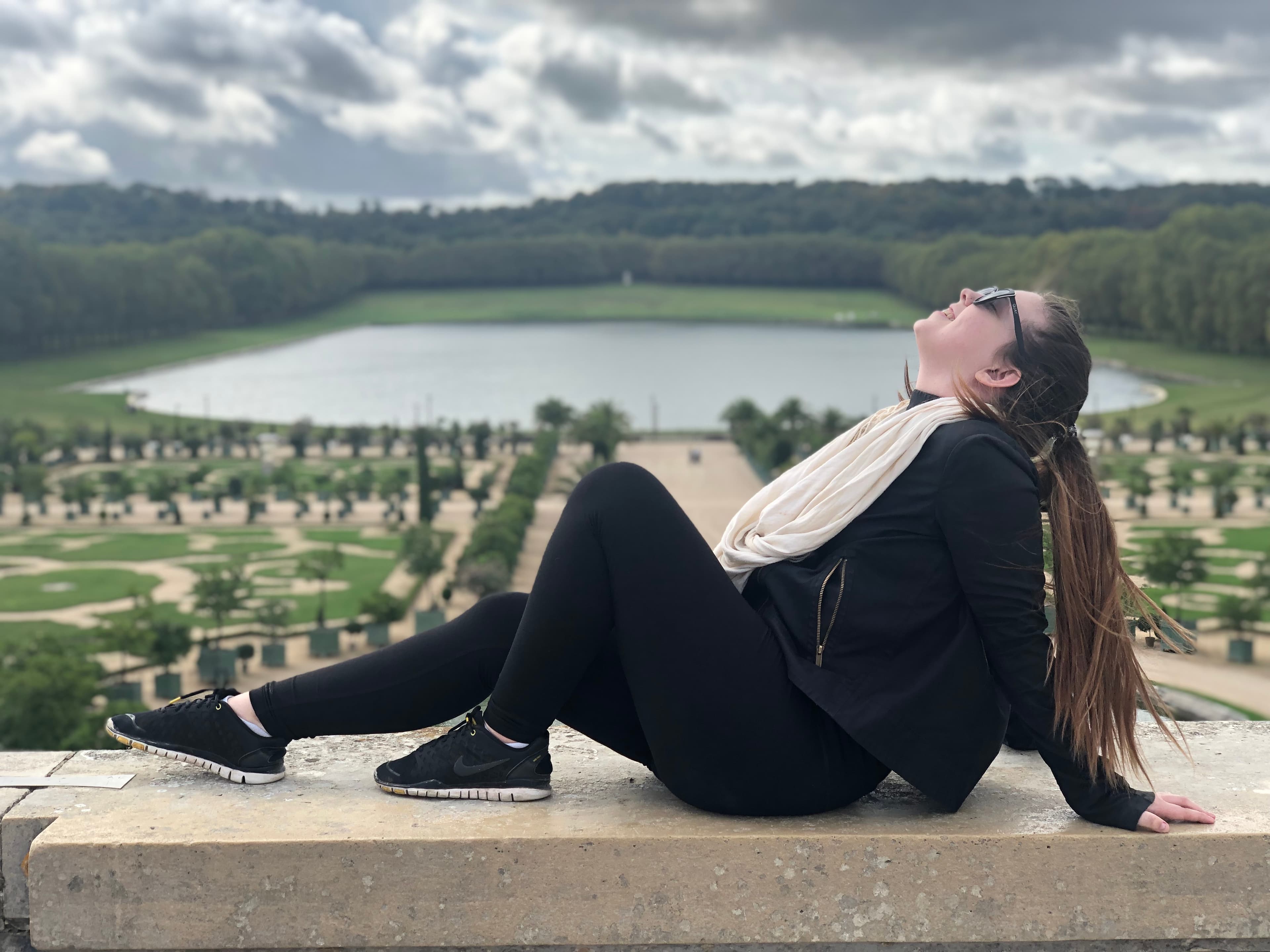 Posing for a photo at the Palace of Versailles