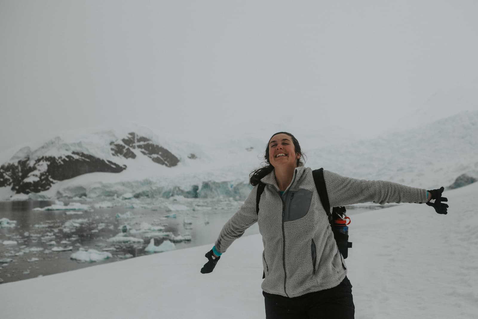 Travel advisor Rachel posing for a picture in icy landscape in Antarctica