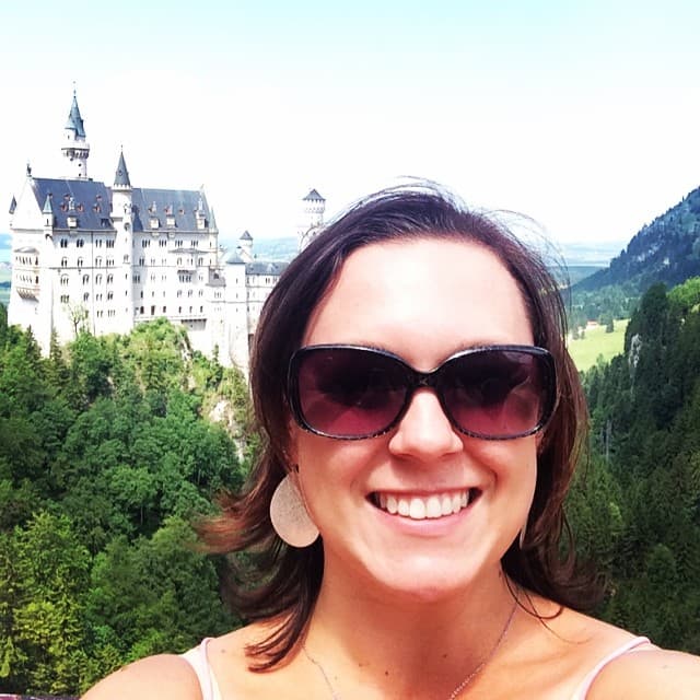 Posing for a photo with the view of Neuschwanstein Castle