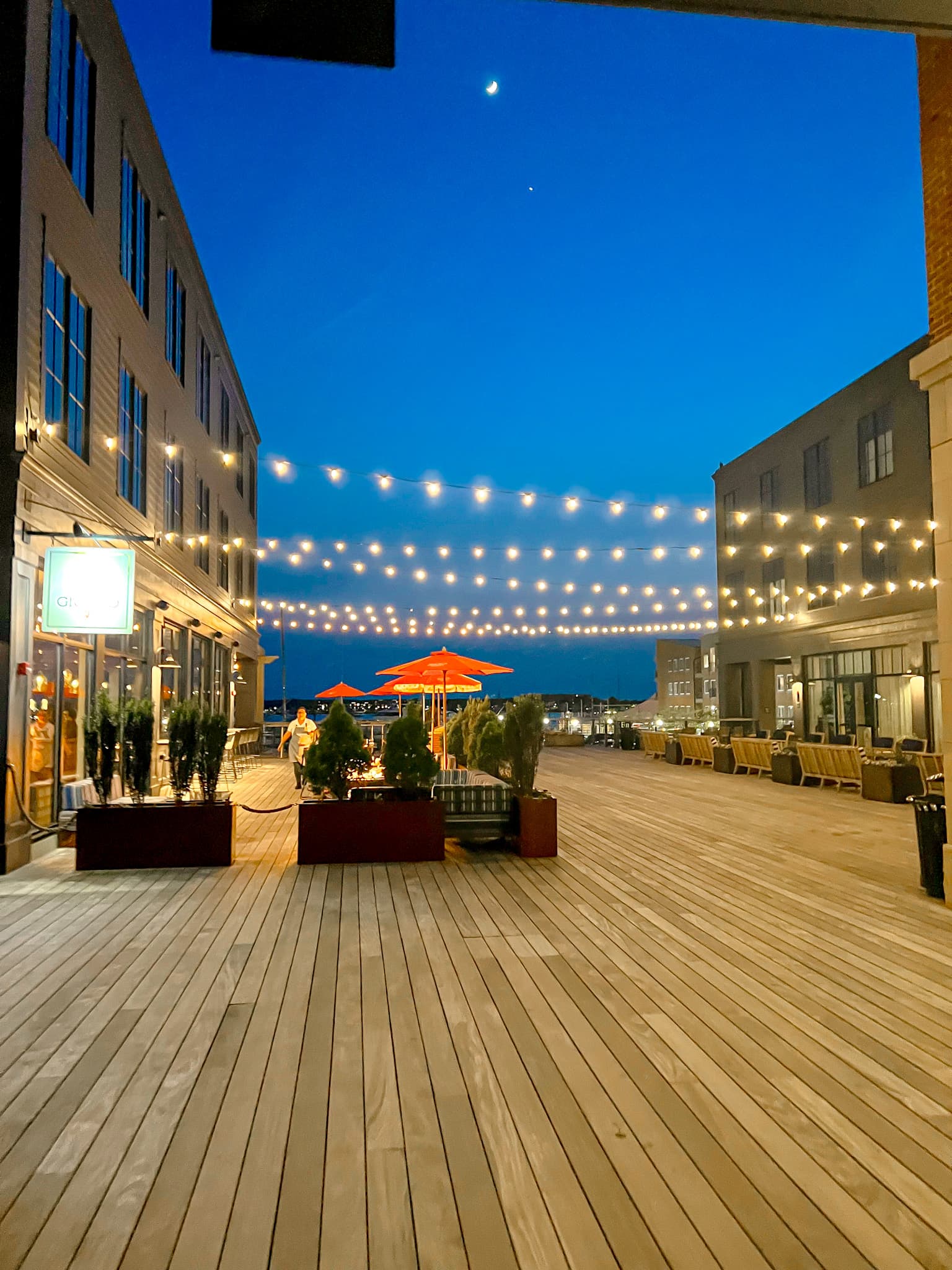 Beautiful outdoor deck area of Hammetts Hotel at night with string lights hanging