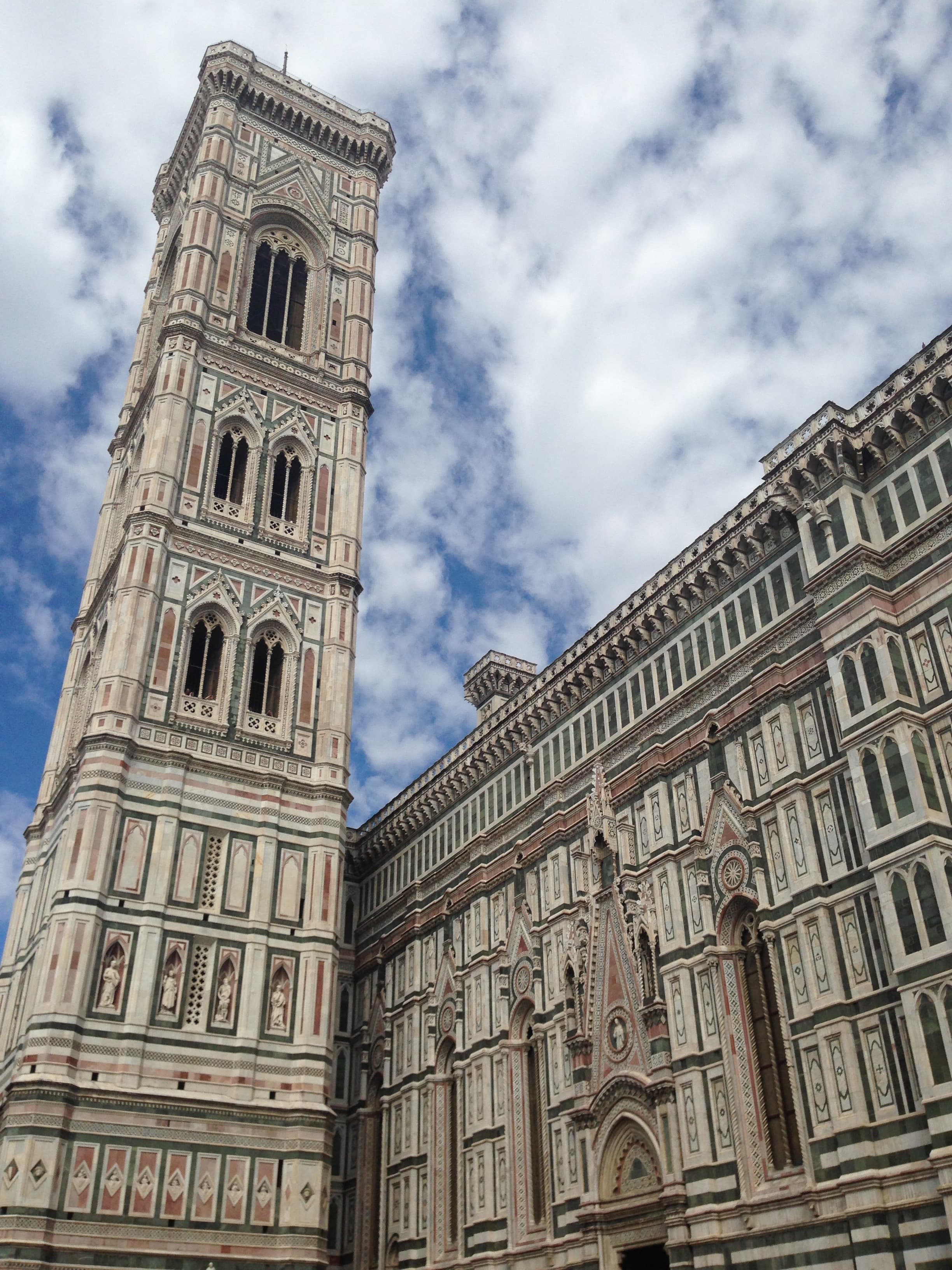 view of a tall historical building during the daytime.