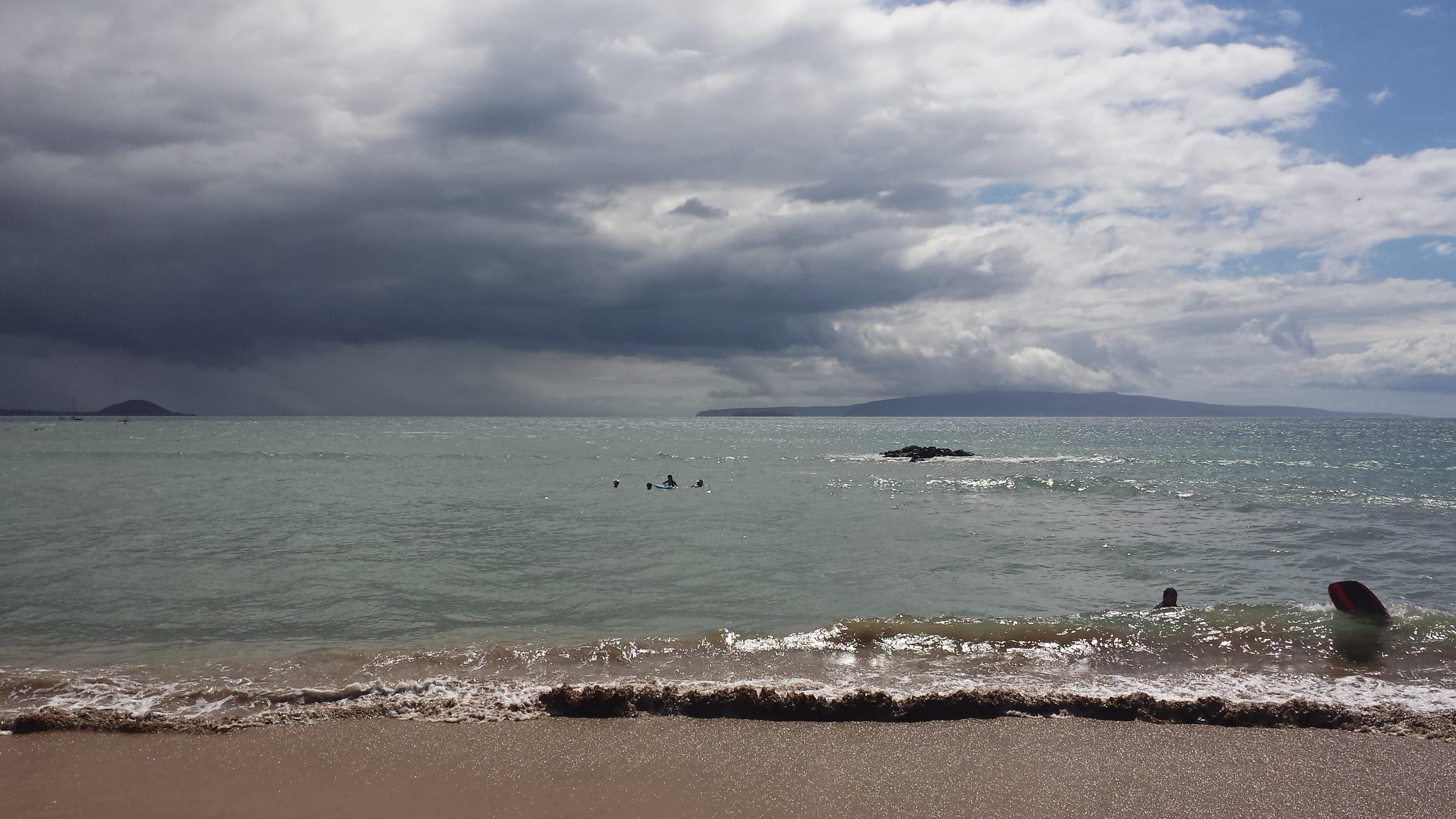 View of the beach on a cloudy day