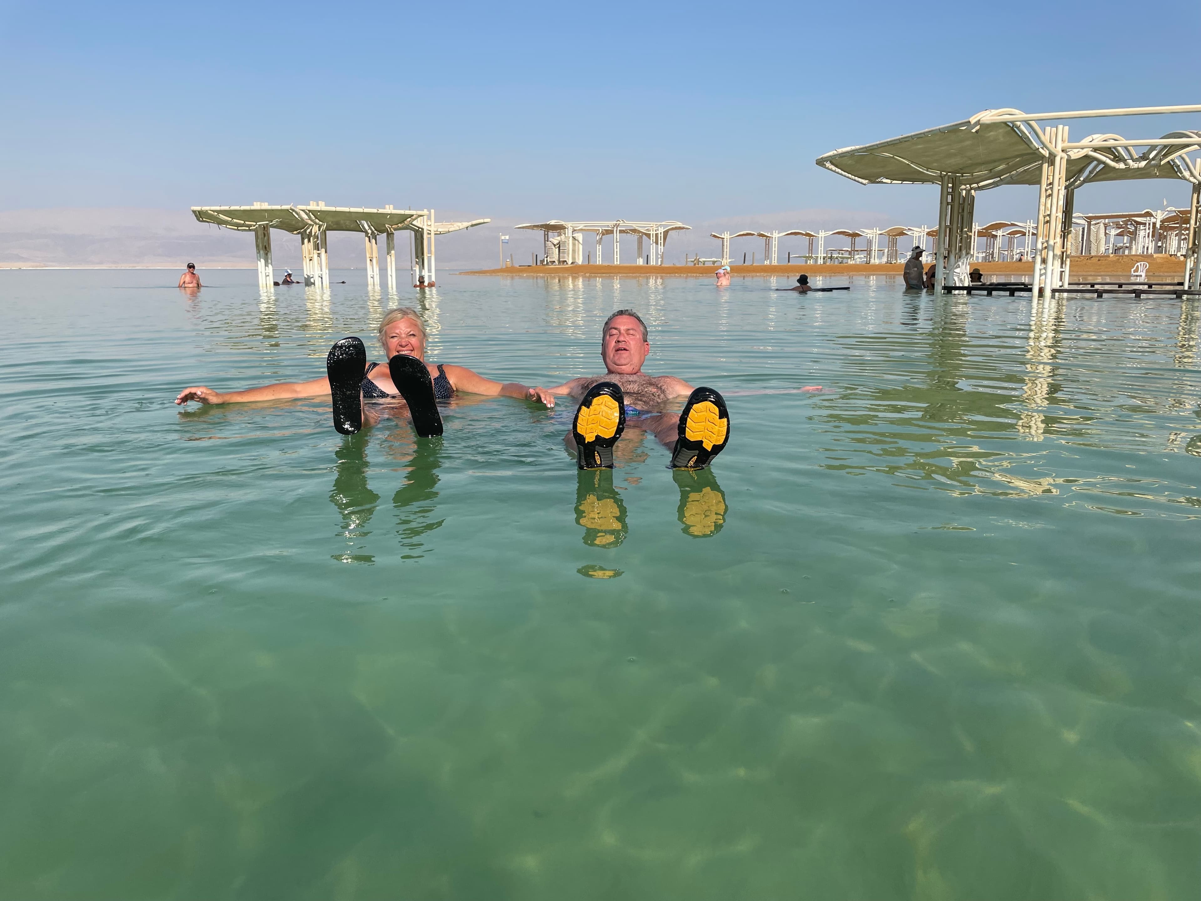 Travel advisor Leah Bedgood and spouse floating in water