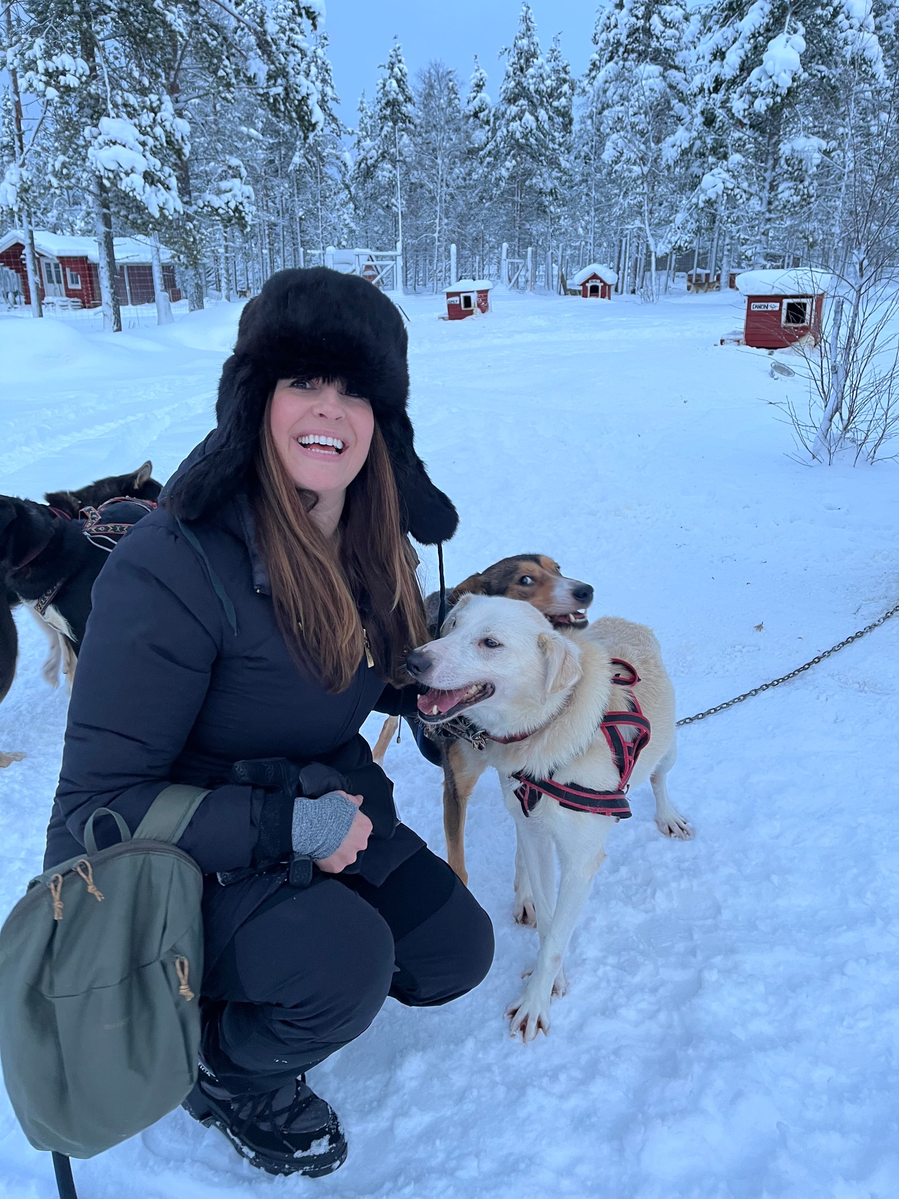 Picture of Allyson with dog in snow