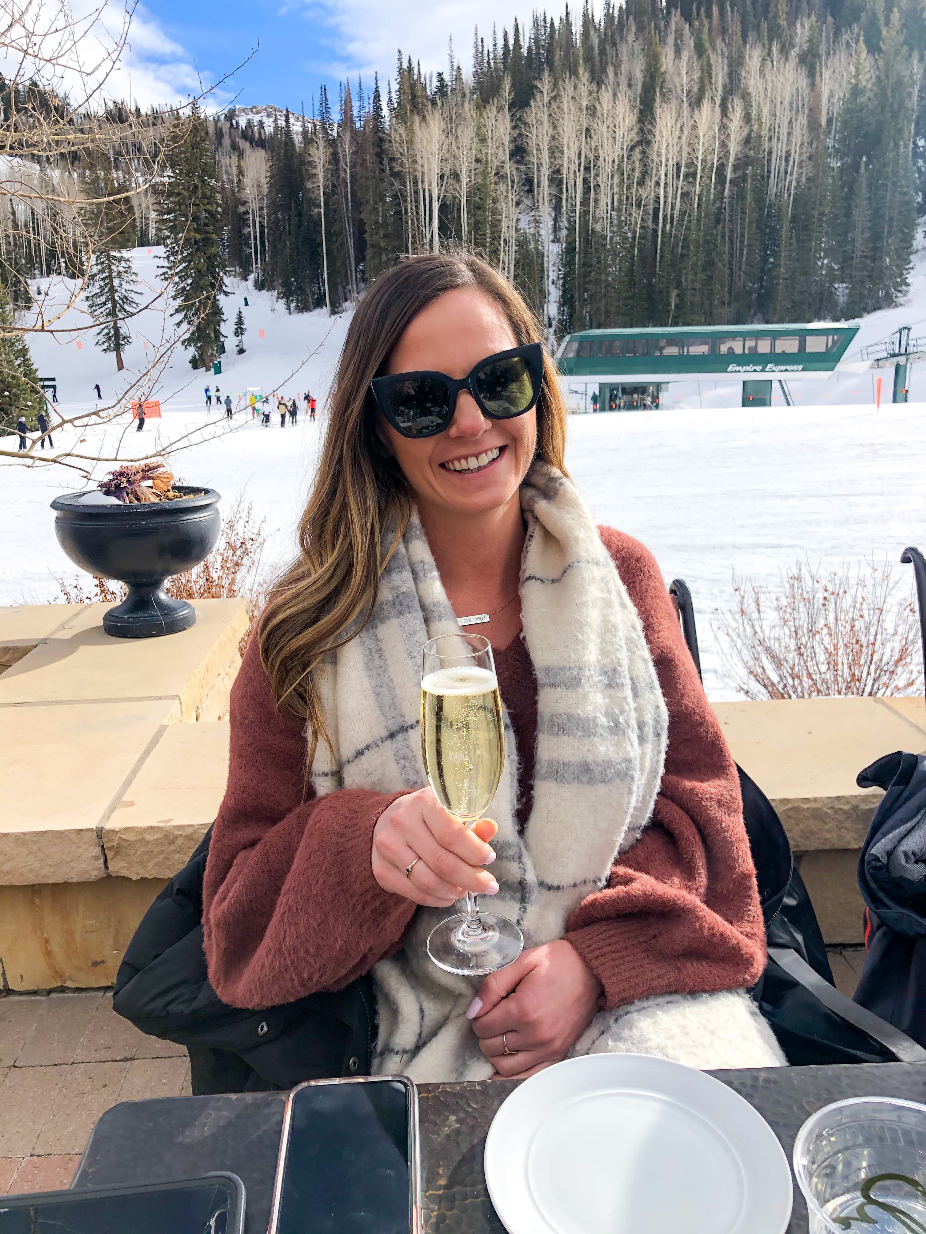 Holding a glass of champagne